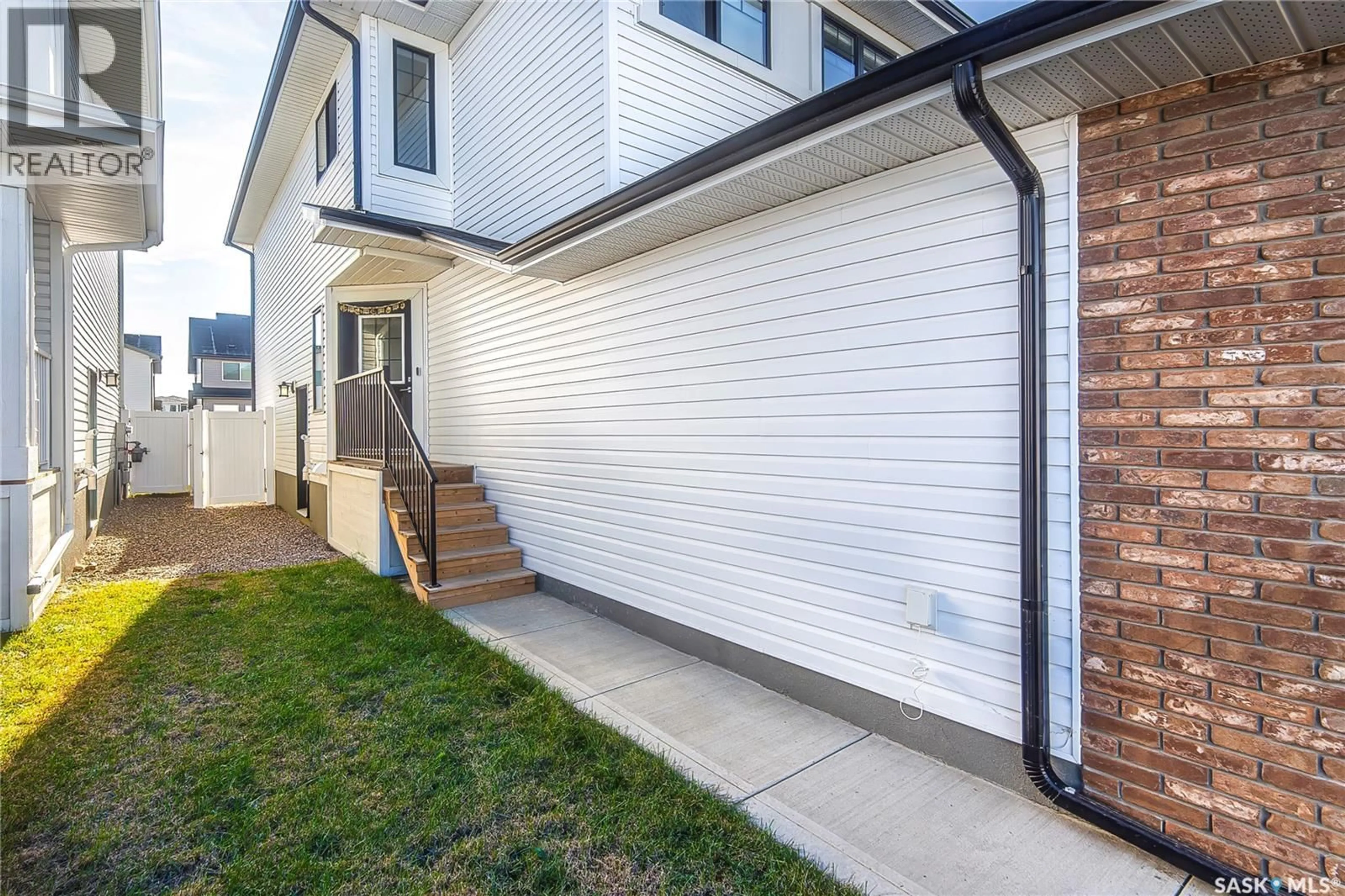 Home with brick exterior material, street for 148 TUFTS WAY, Saskatoon Saskatchewan S7V1P4