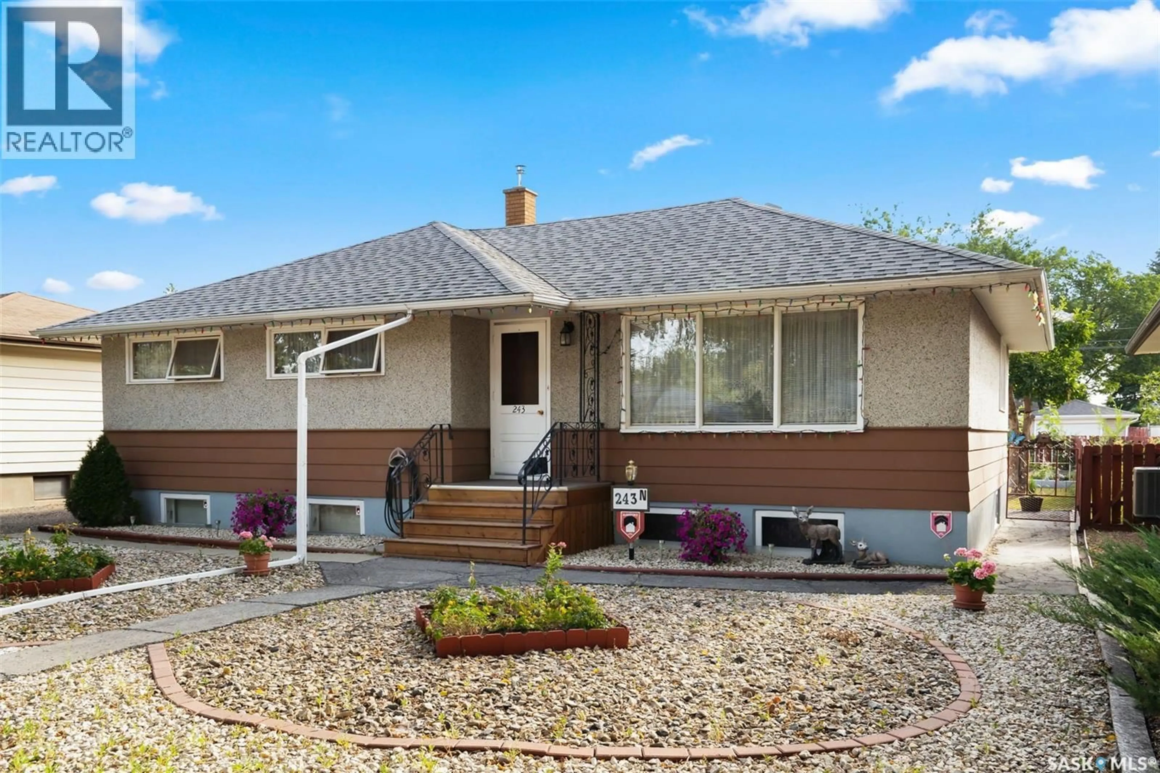 Home with vinyl exterior material, street for 243 MONTREAL STREET, Regina Saskatchewan S4R3T1