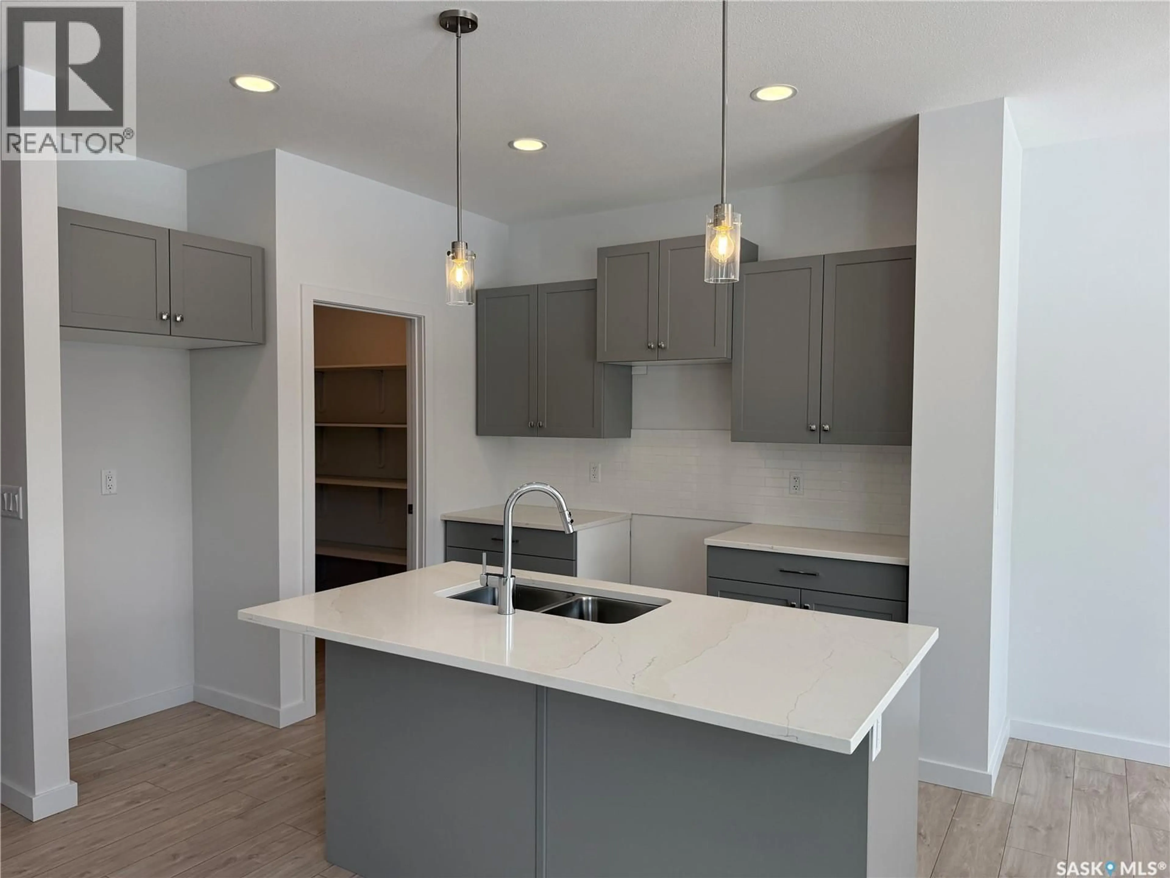 Open concept kitchen, unknown for 919 TRAEGER MANOR, Saskatoon Saskatchewan S7V1V8