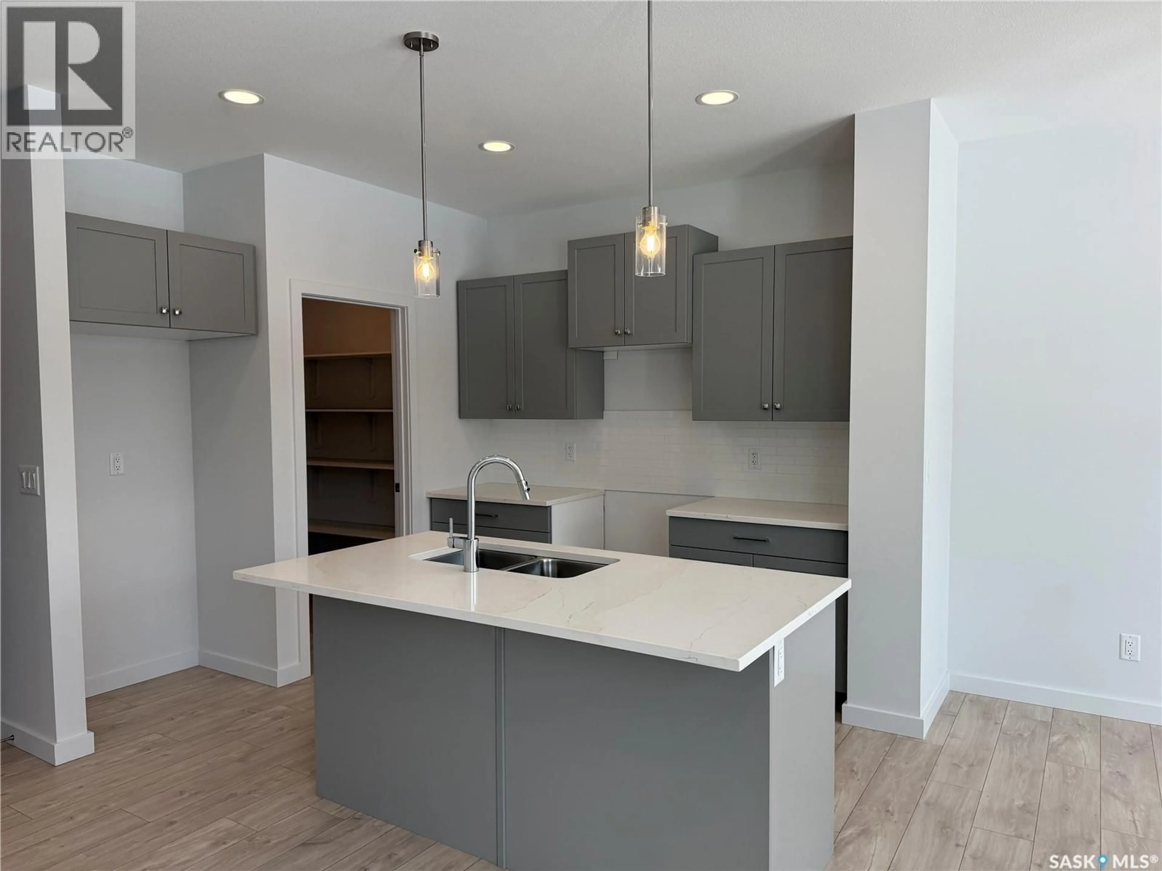 Open concept kitchen, unknown for 919 TRAEGER MANOR, Saskatoon Saskatchewan S7V1V8