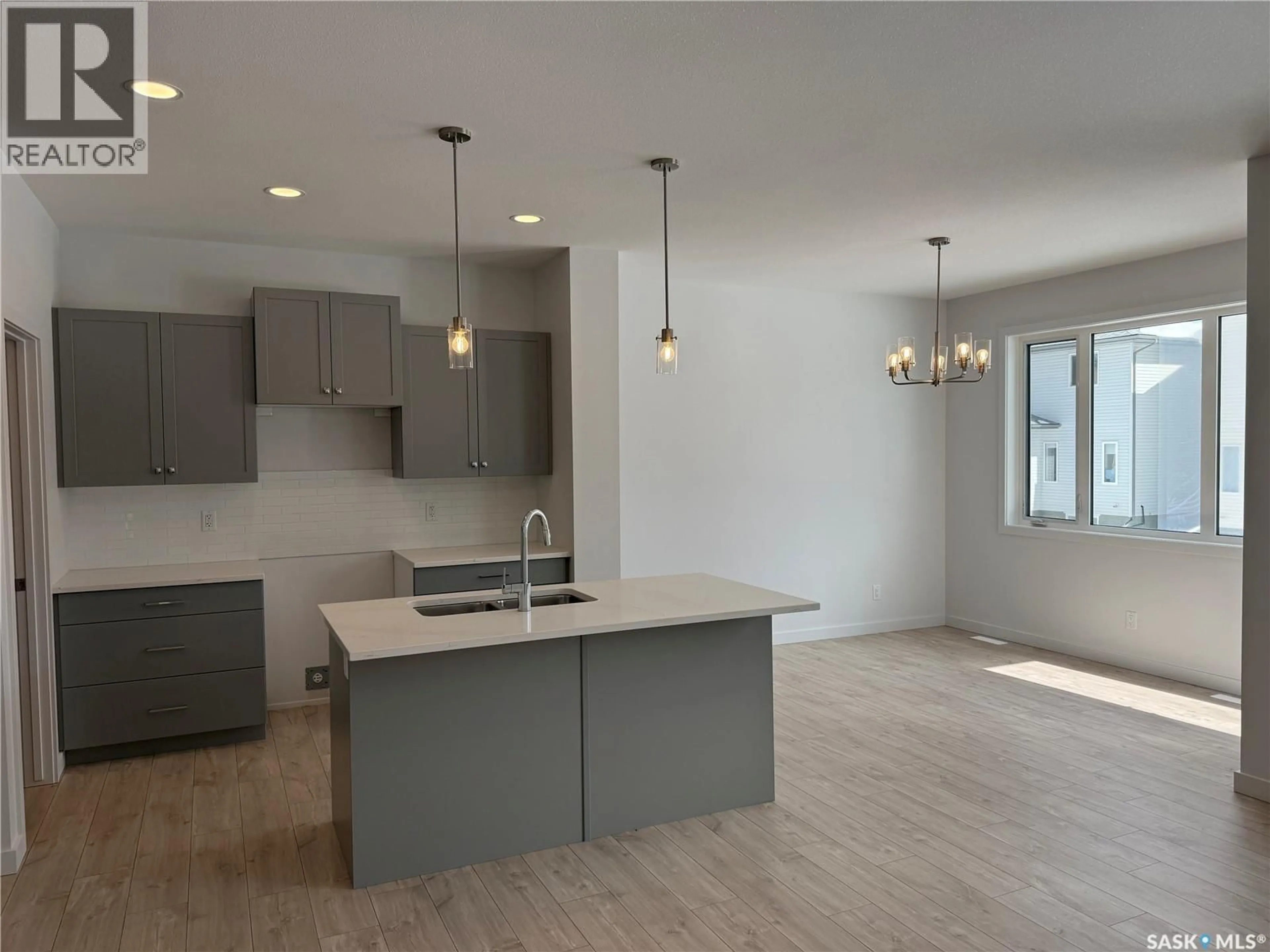 Open concept kitchen, unknown for 919 TRAEGER MANOR, Saskatoon Saskatchewan S7V1V8
