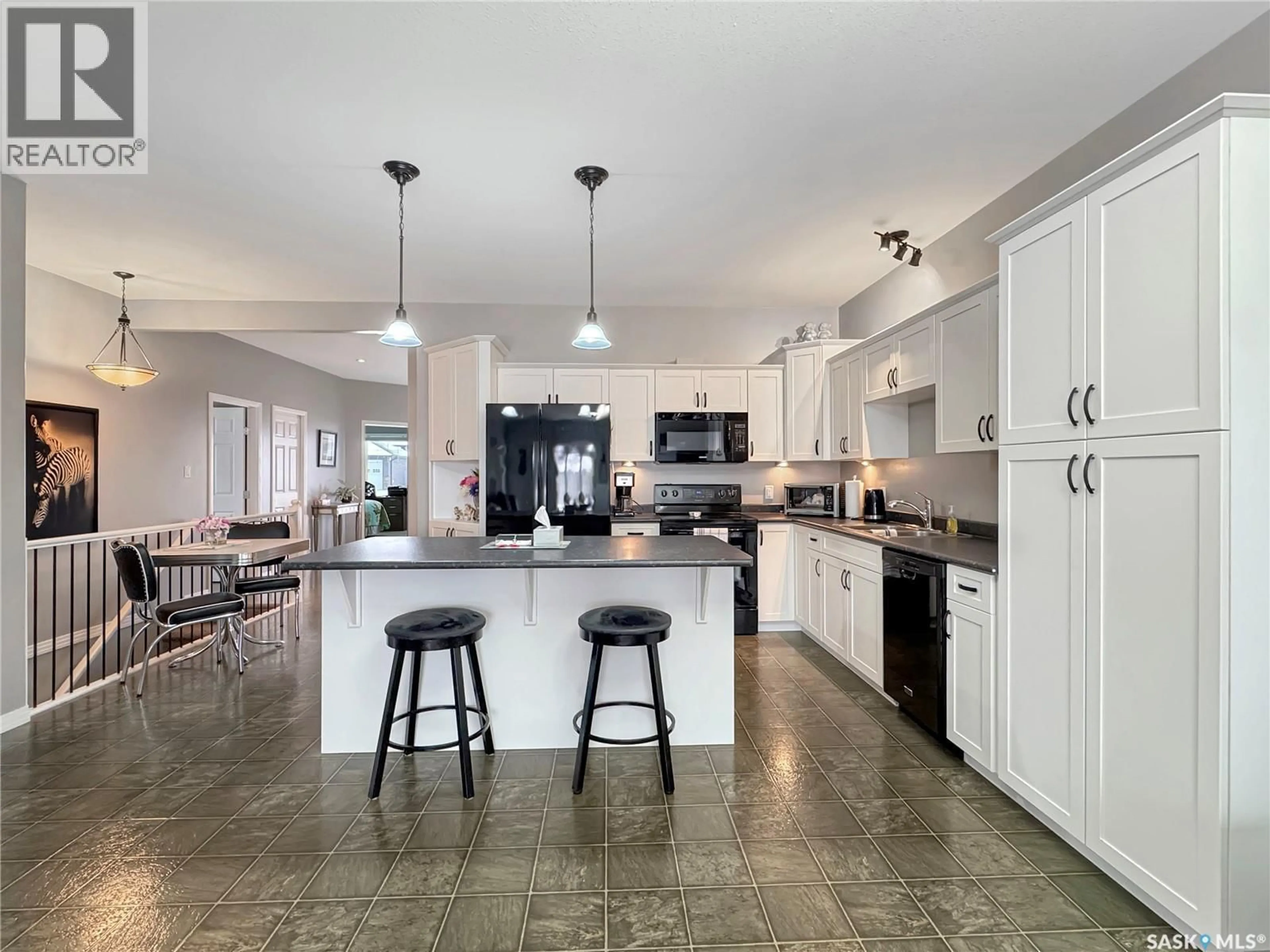 Open concept kitchen, ceramic/tile floor for C - 2301 AMOS DRIVE, North Battleford Saskatchewan S9A1B6