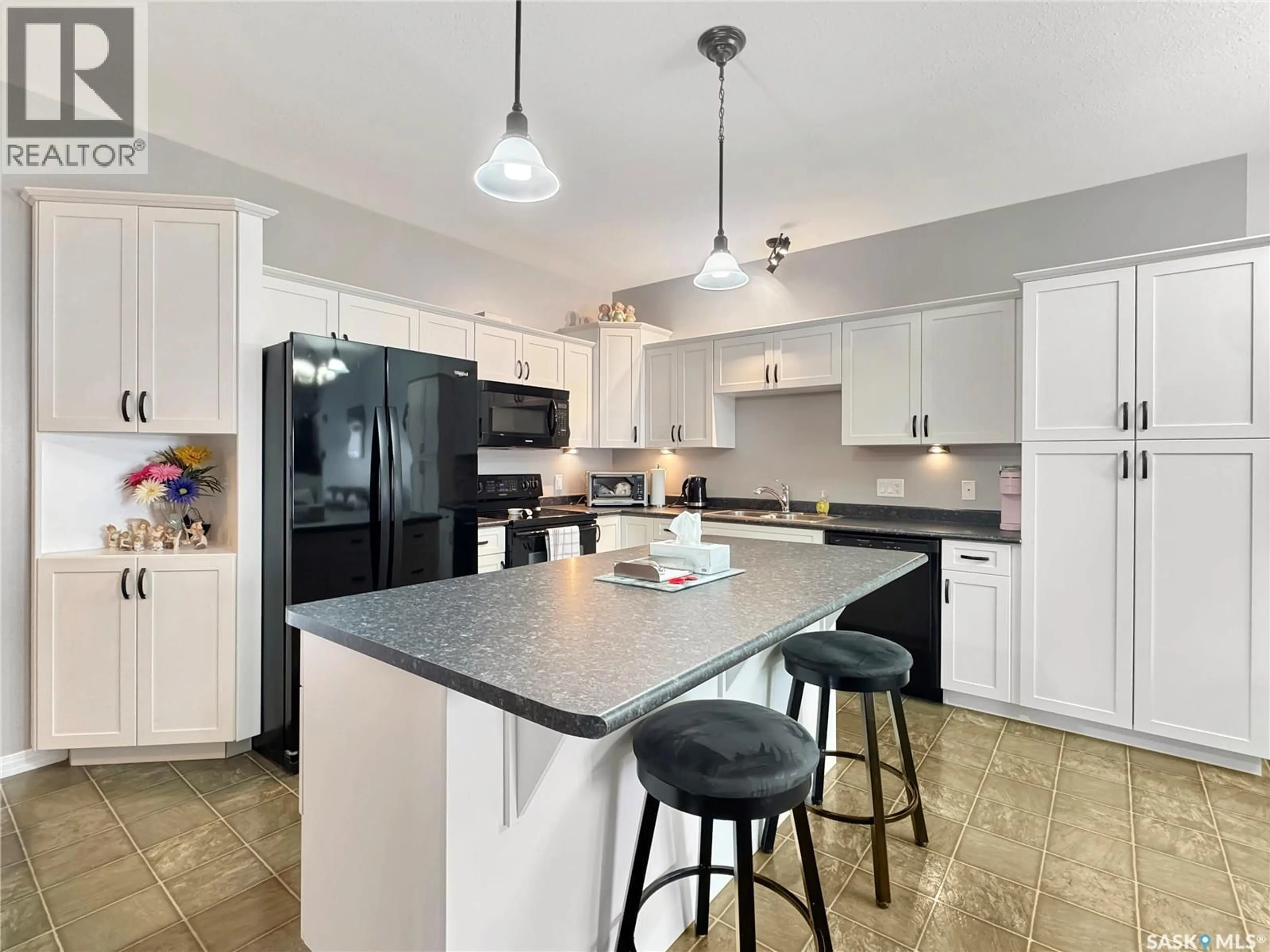 Open concept kitchen, ceramic/tile floor for C - 2301 AMOS DRIVE, North Battleford Saskatchewan S9A1B6