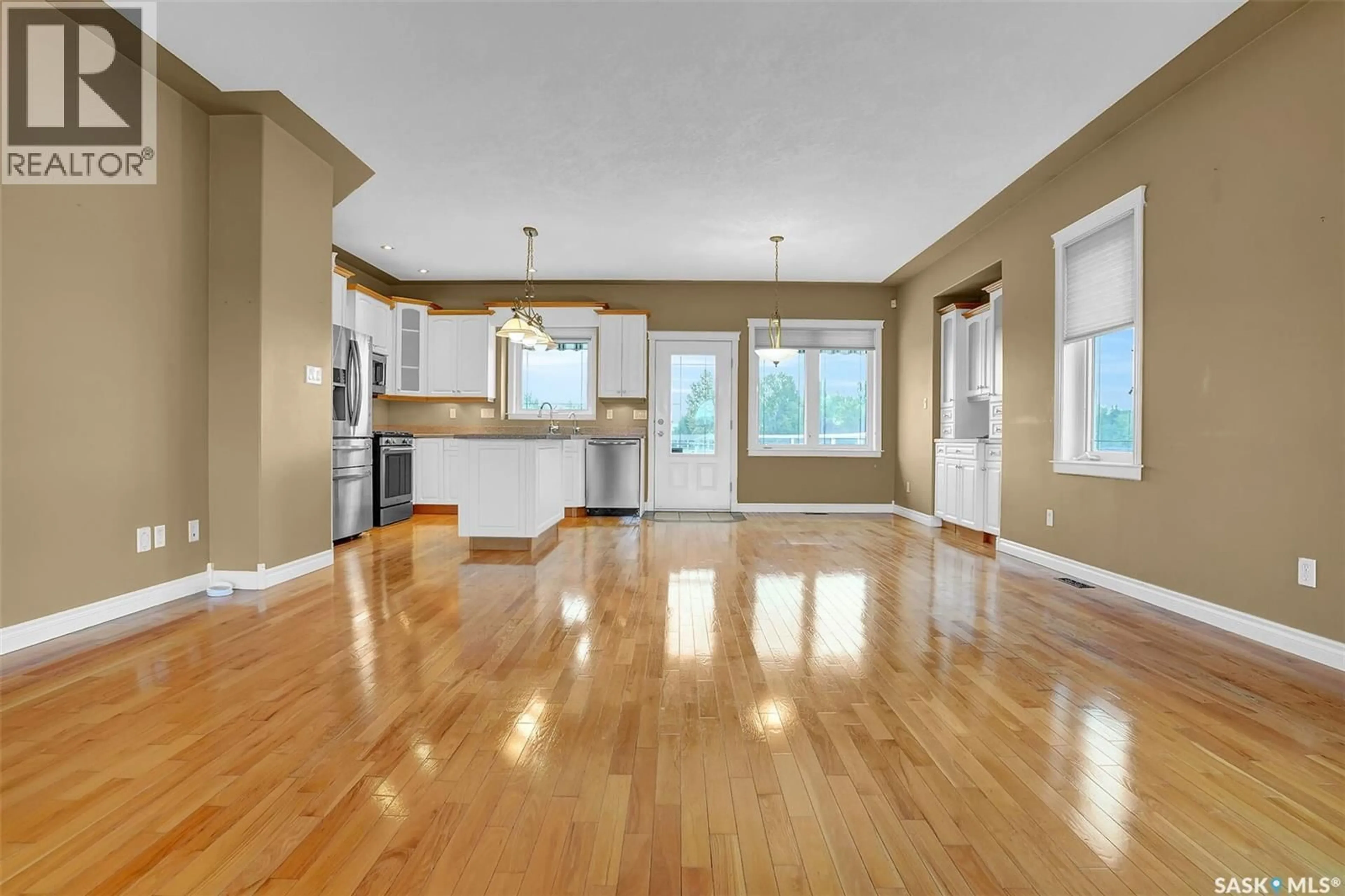 Open concept kitchen, wood/laminate floor for 21 WOODS CRESCENT, Edenwold Rm No.158 Saskatchewan S4L1C4
