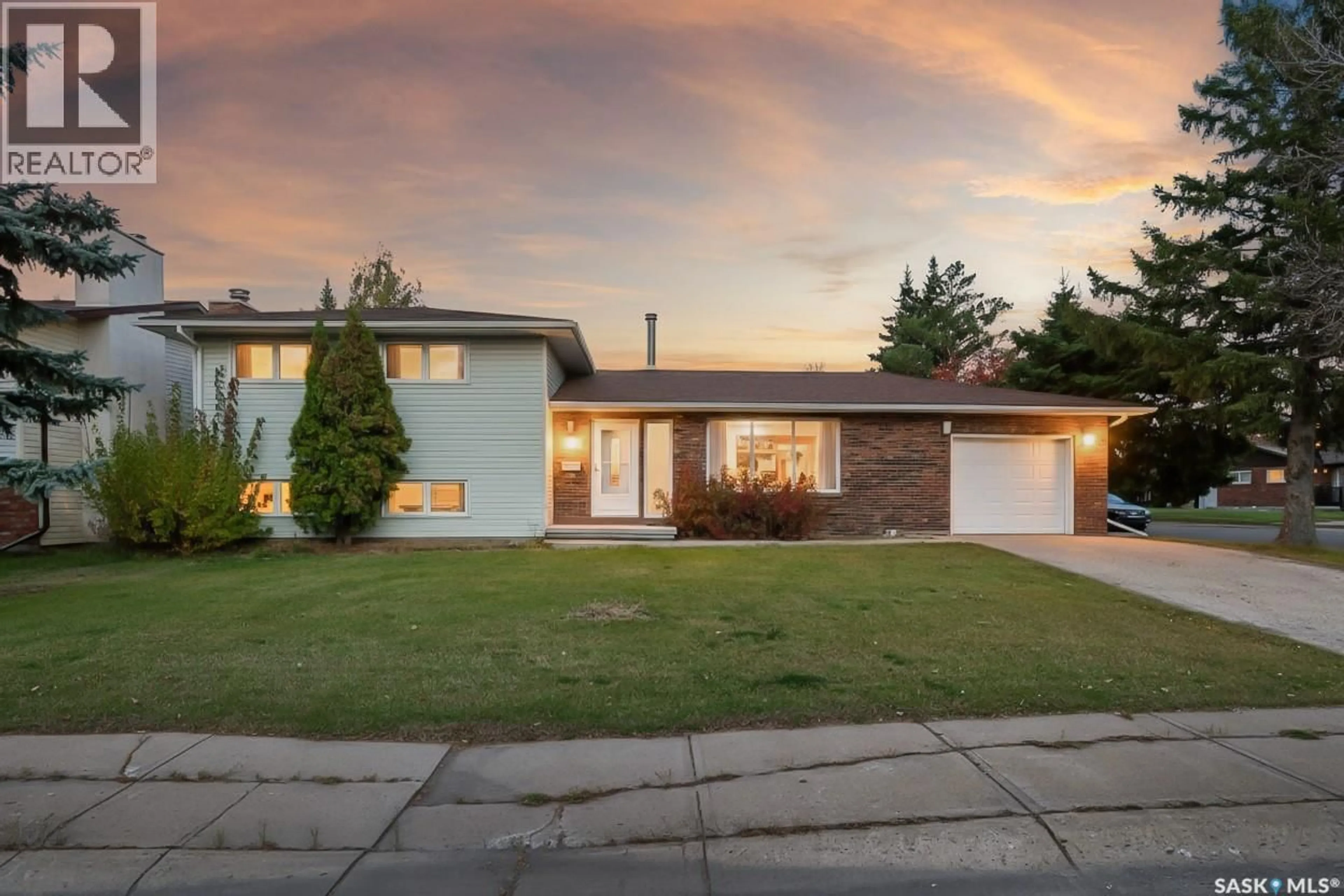 Home with brick exterior material, street for 79 BLUEBELL CRESCENT, Moose Jaw Saskatchewan S6J1A2