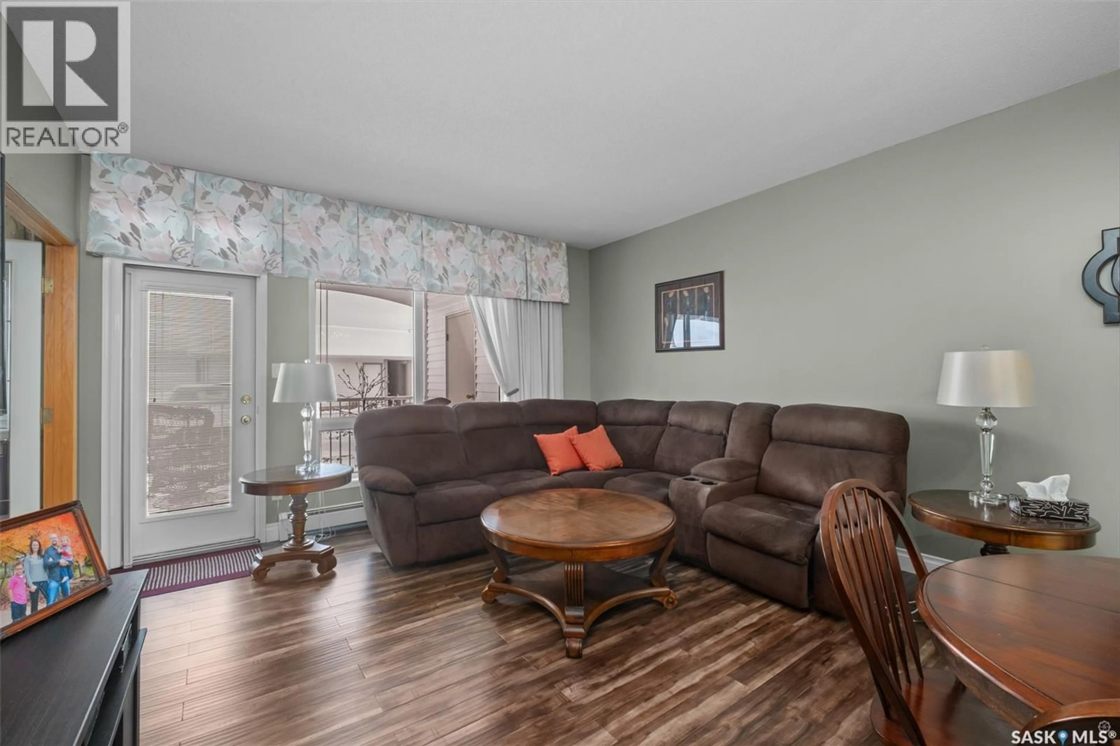 Living room with furniture, wood/laminate floor for 101 - 3590 4TH AVENUE, Prince Albert Saskatchewan S6V8B4