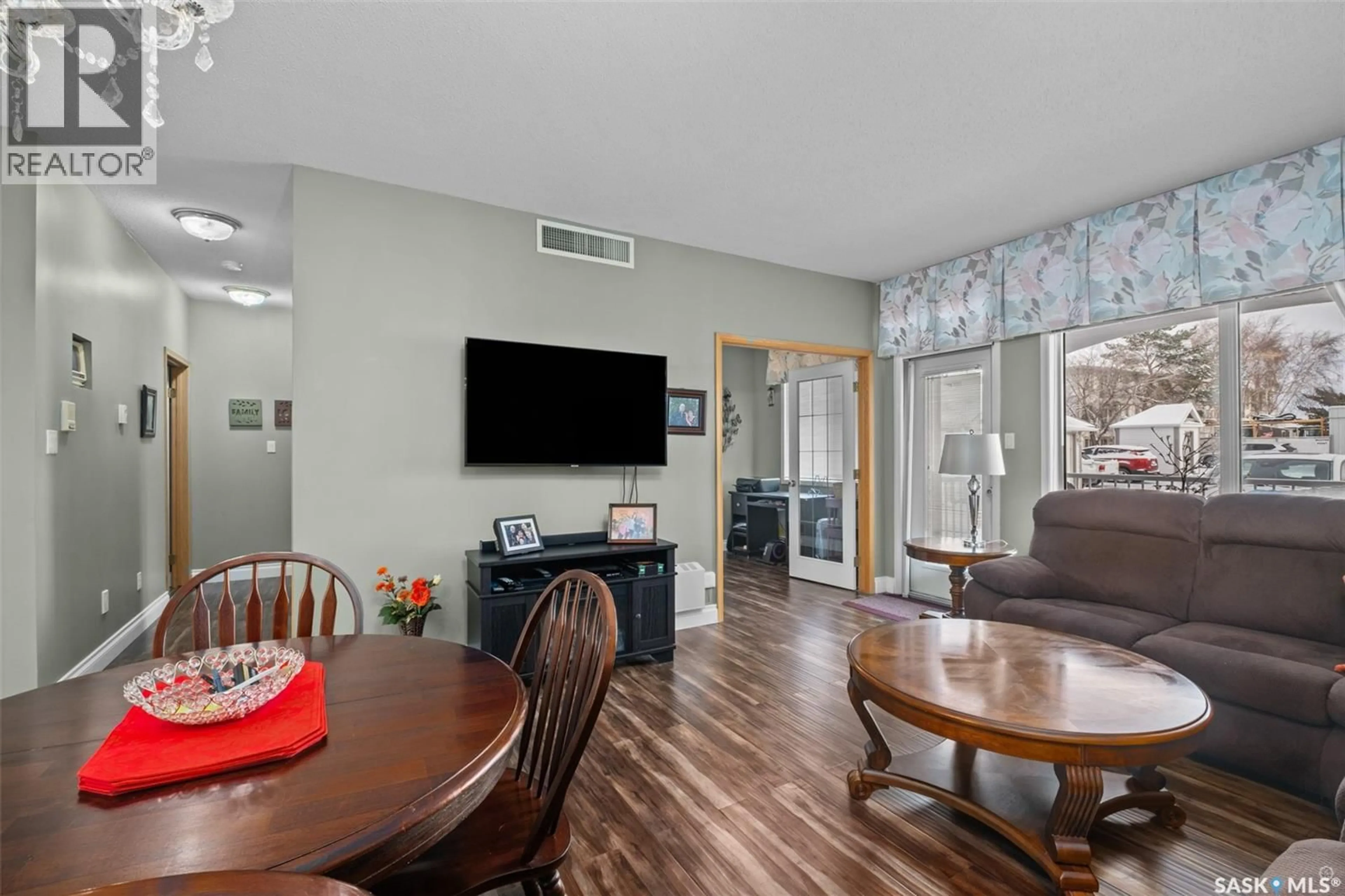 Living room with furniture, wood/laminate floor for 101 - 3590 4TH AVENUE, Prince Albert Saskatchewan S6V8B4