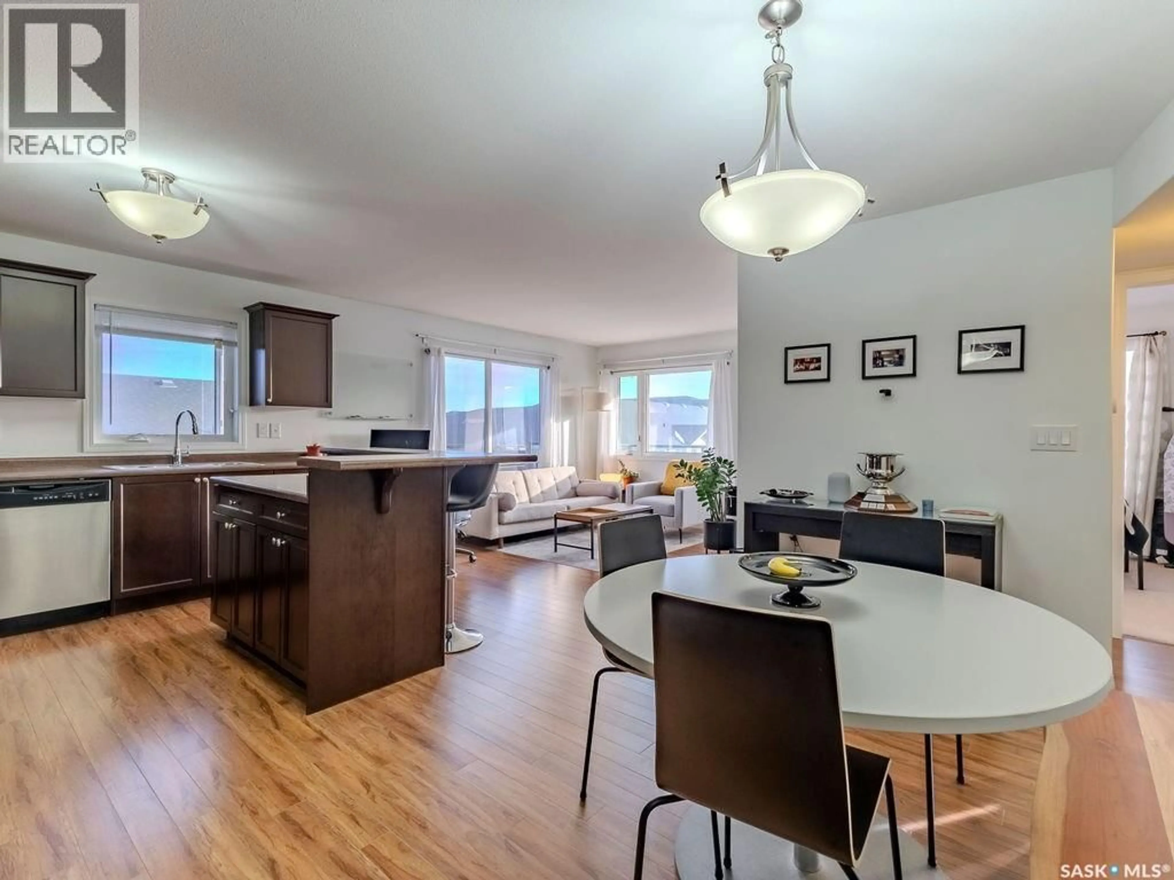 Open concept kitchen, wood/laminate floor for 6305 112 WILLIS CRESCENT, Saskatoon Saskatchewan S7T0N5