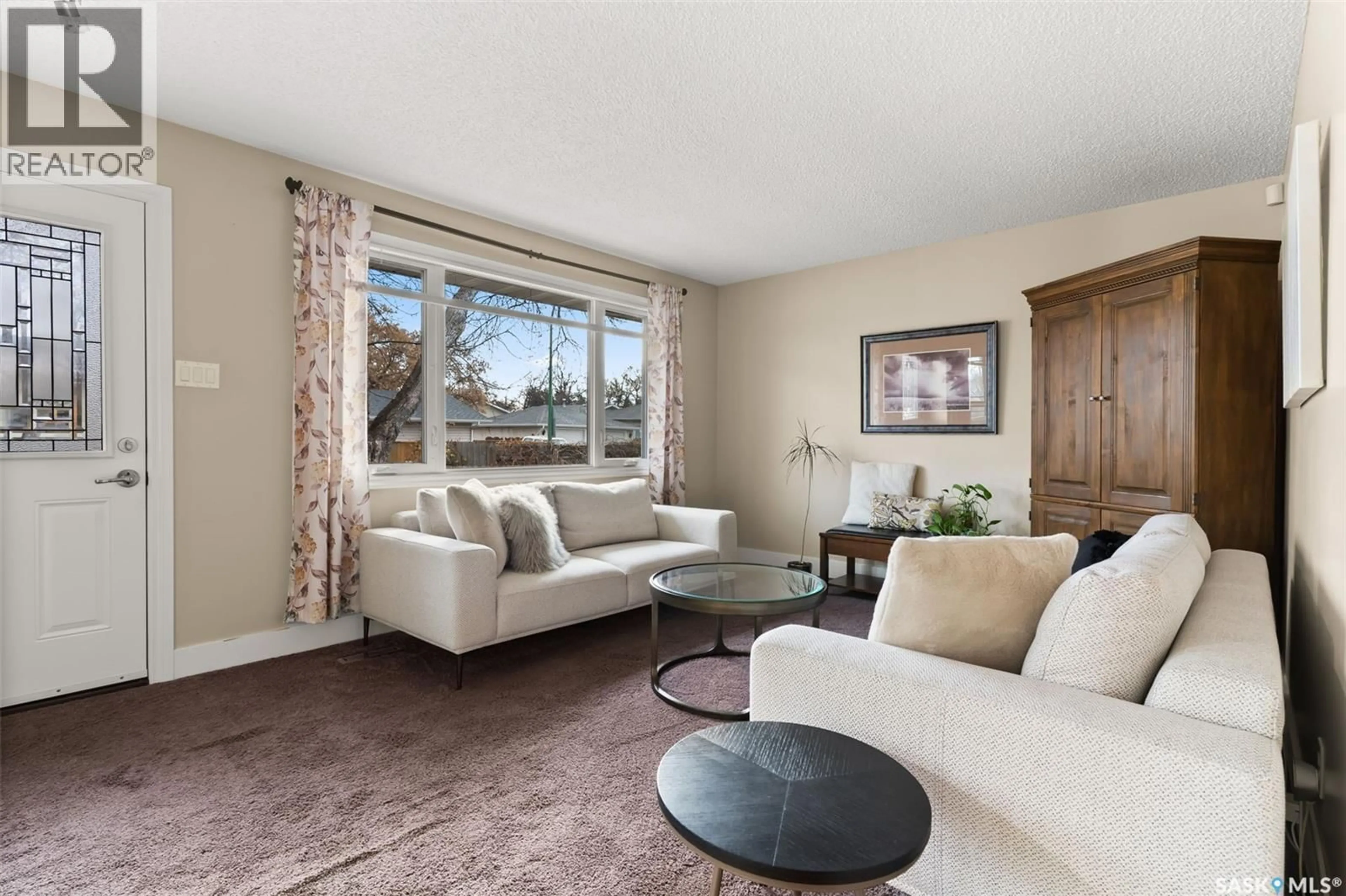 Living room with furniture, carpet floor for 58 FYFE STREET, Regina Saskatchewan S4X1W6