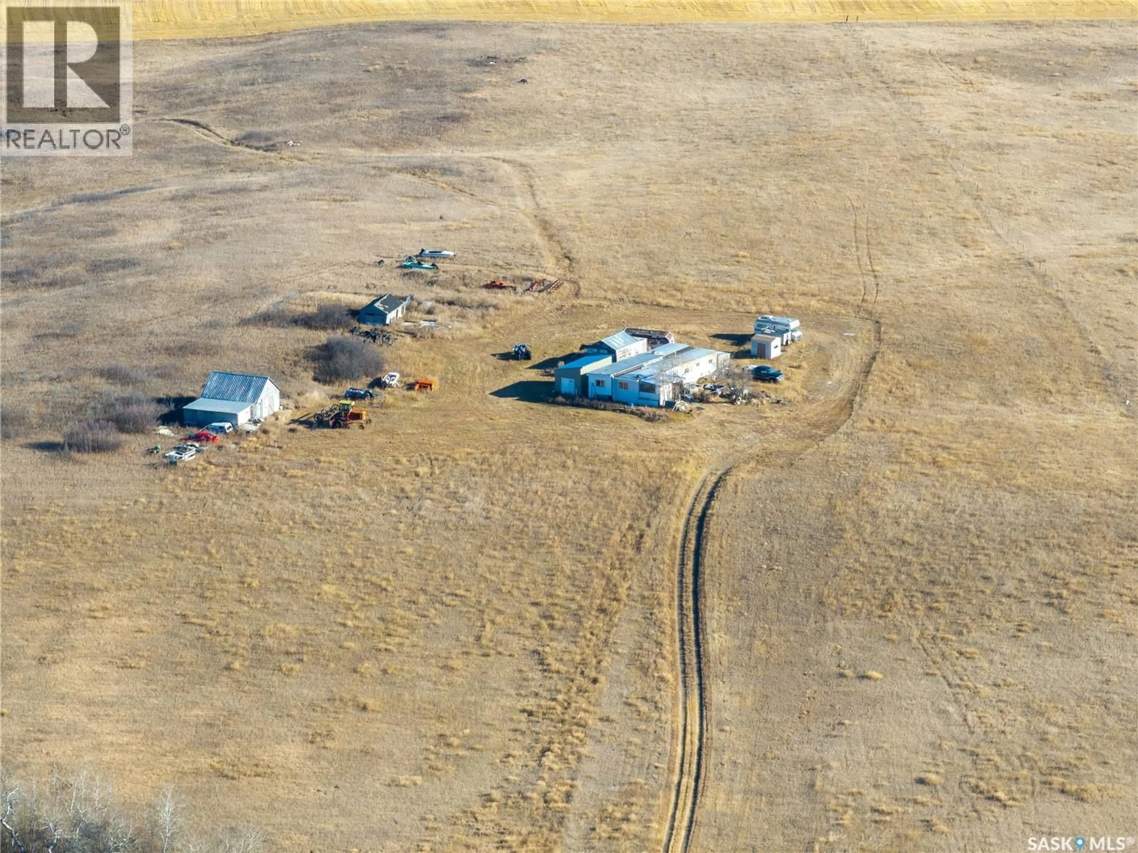 A pic from outside/outdoor area/front of a property/back of a property/a pic from drone, street for -04 - 34 NW 3, Vanscoy Rm No. 345 Saskatchewan S0L3J0