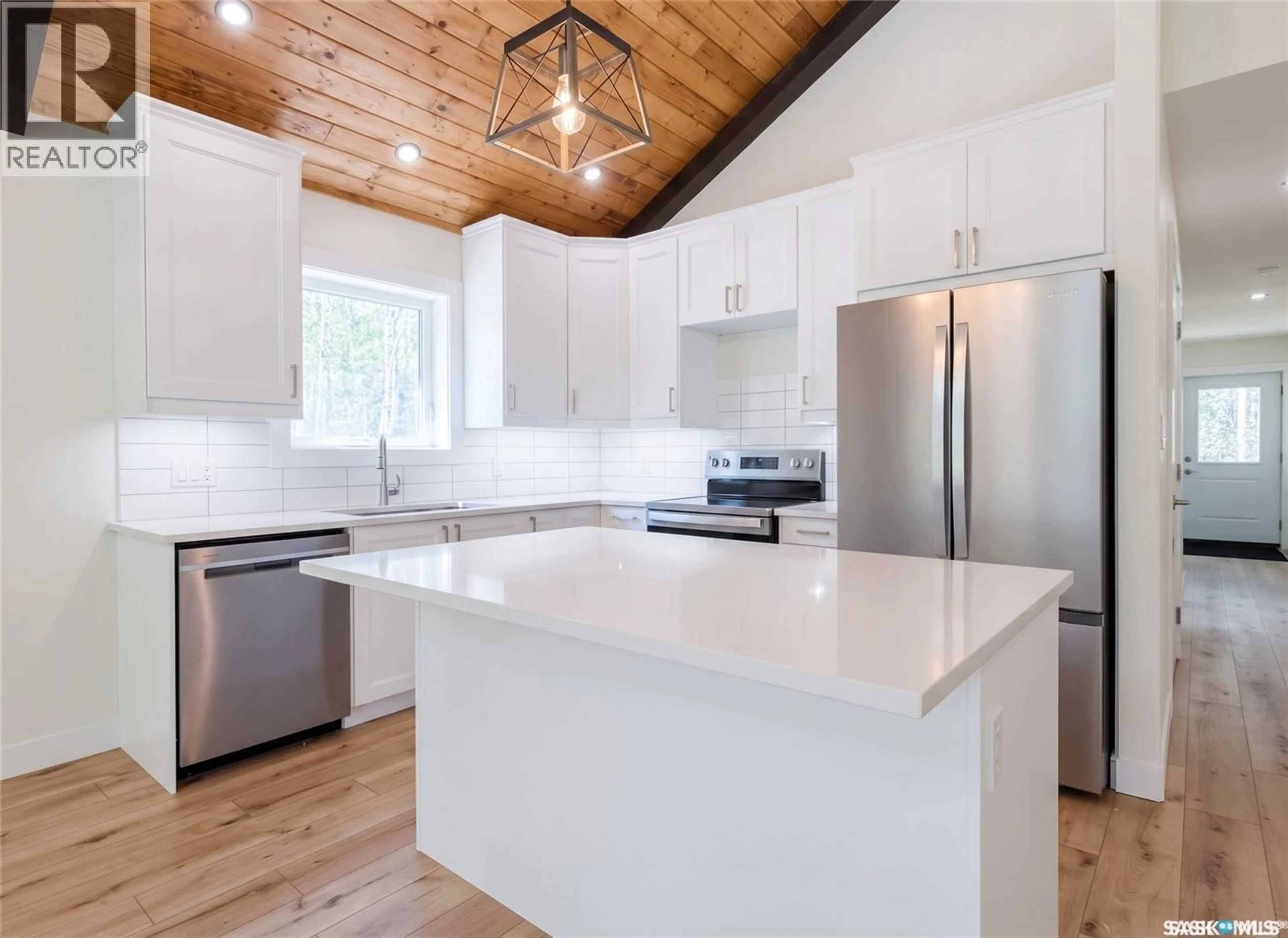 Open concept kitchen, wood/laminate floor for 20 VALLEY RIDGE ROAD, Candle Lake Saskatchewan S0J3E0