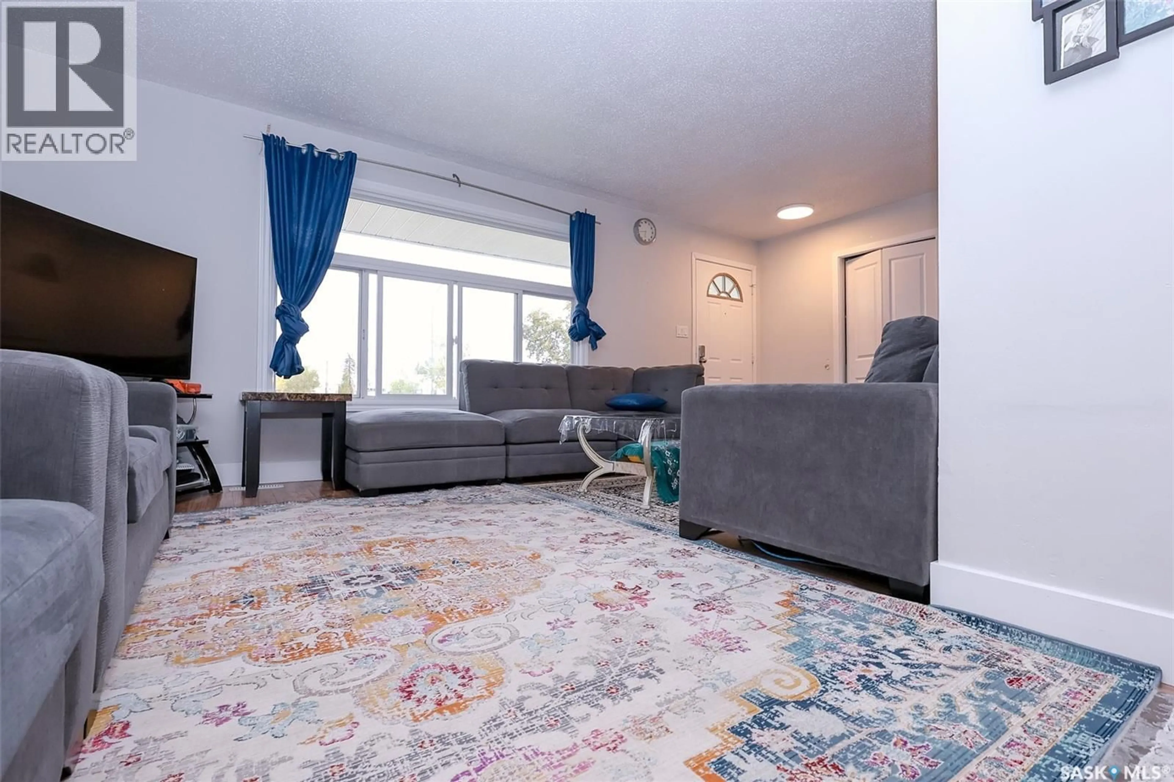 Living room with furniture, carpet floor for 1614 MCKERCHER DRIVE, Saskatoon Saskatchewan S7H5E1