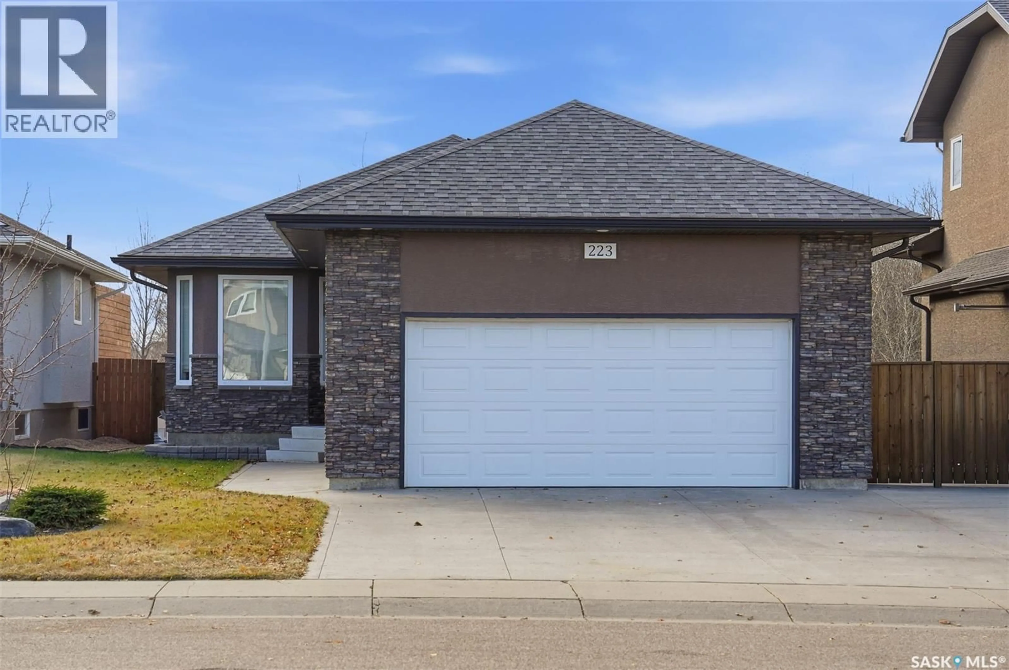 Home with brick exterior material, street for 223 REMPEL LANE, Saskatoon Saskatchewan S7T0J3