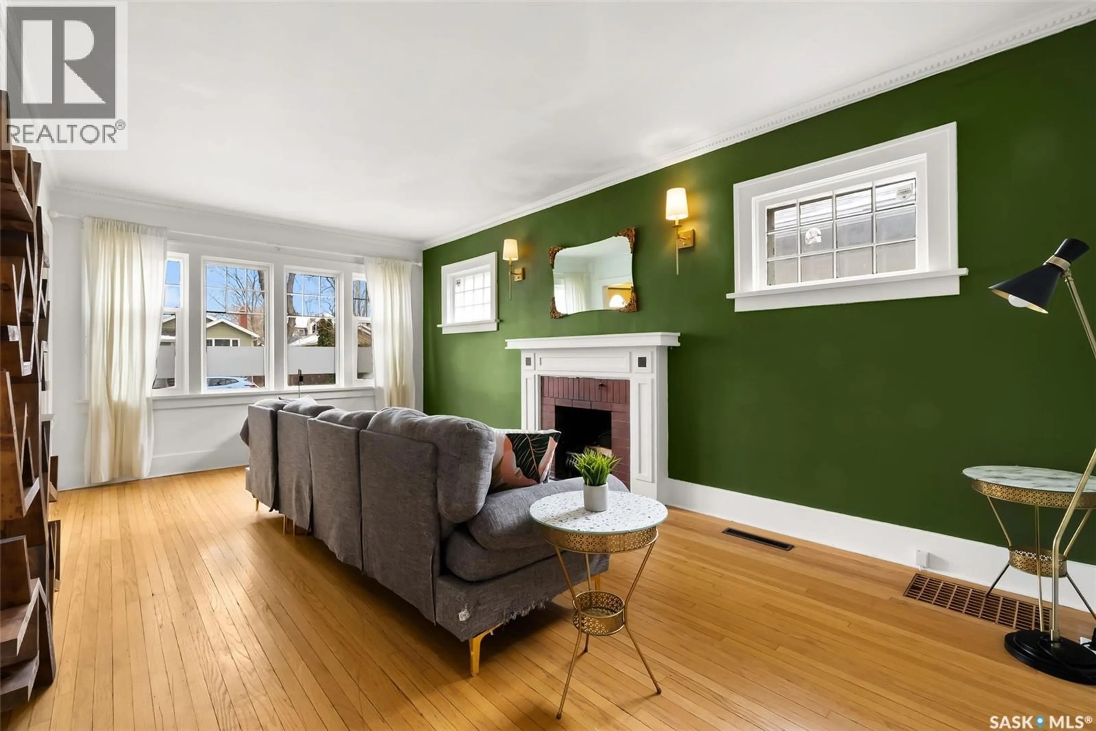 Living room with furniture, wood/laminate floor for 2314 ELPHINSTONE STREET, Regina Saskatchewan S4T3P1