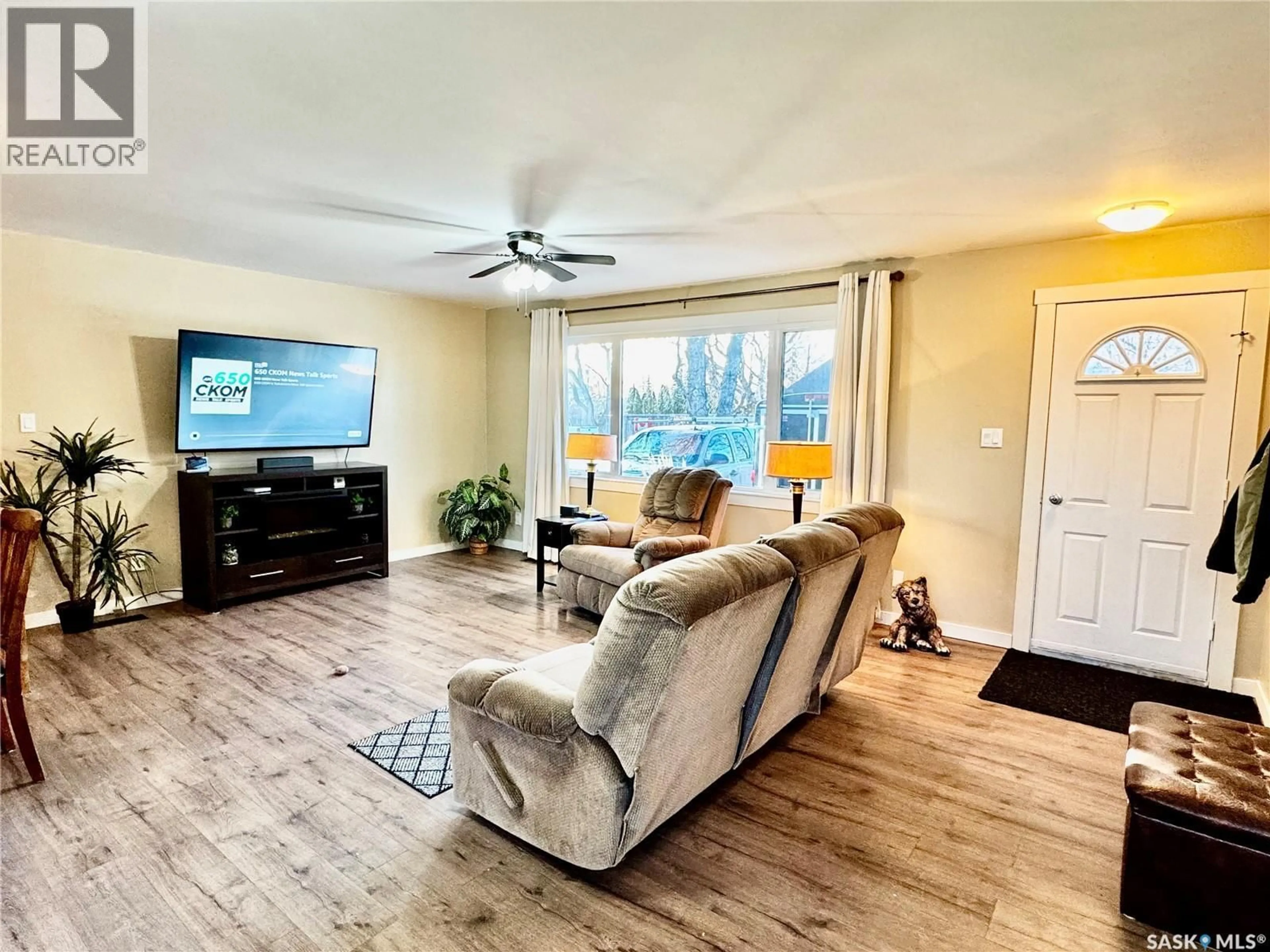 Living room with furniture, wood/laminate floor for 220 6TH STREET, Humboldt Saskatchewan S0K2A0