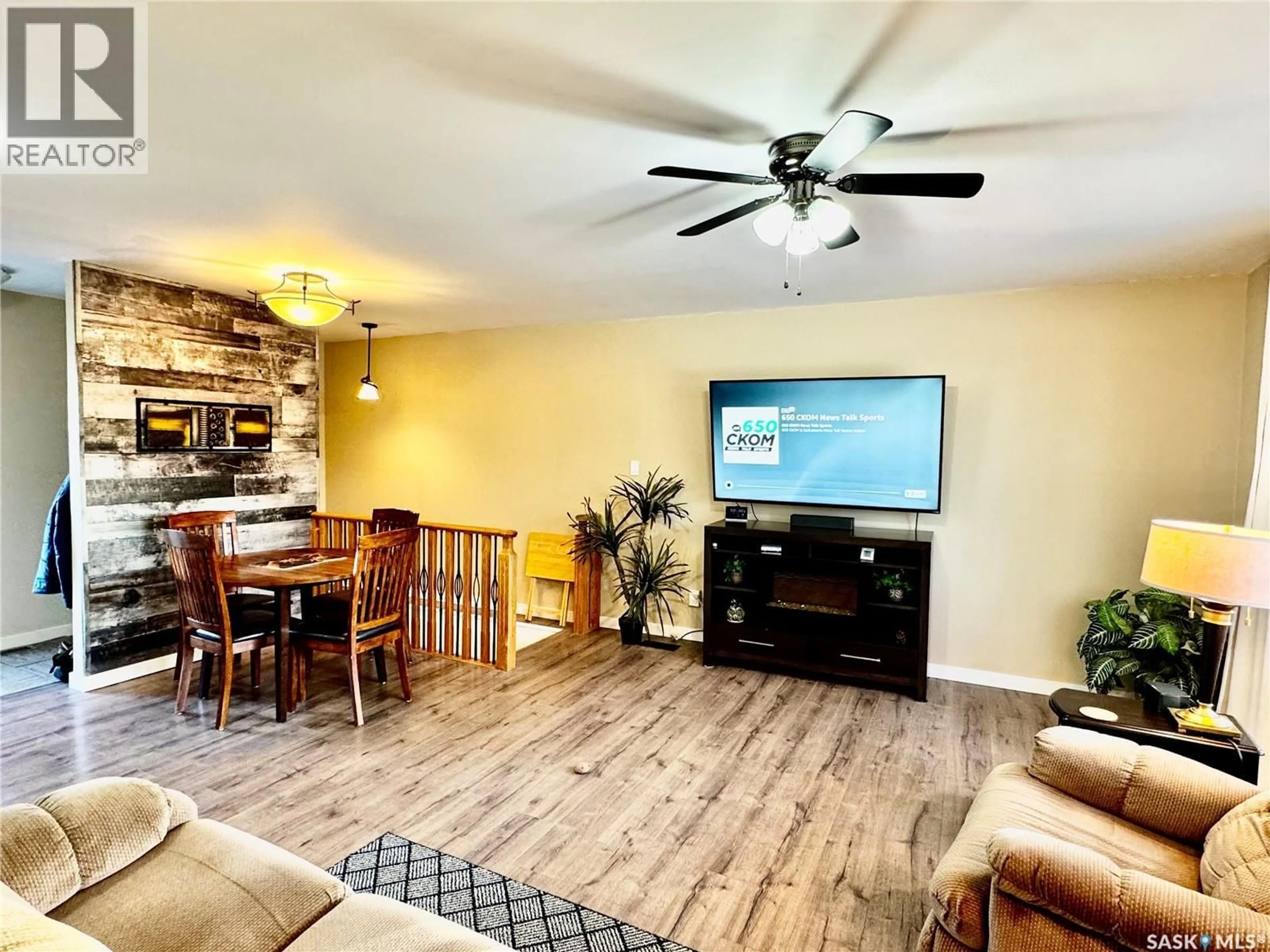 Living room with furniture, wood/laminate floor for 220 6TH STREET, Humboldt Saskatchewan S0K2A0