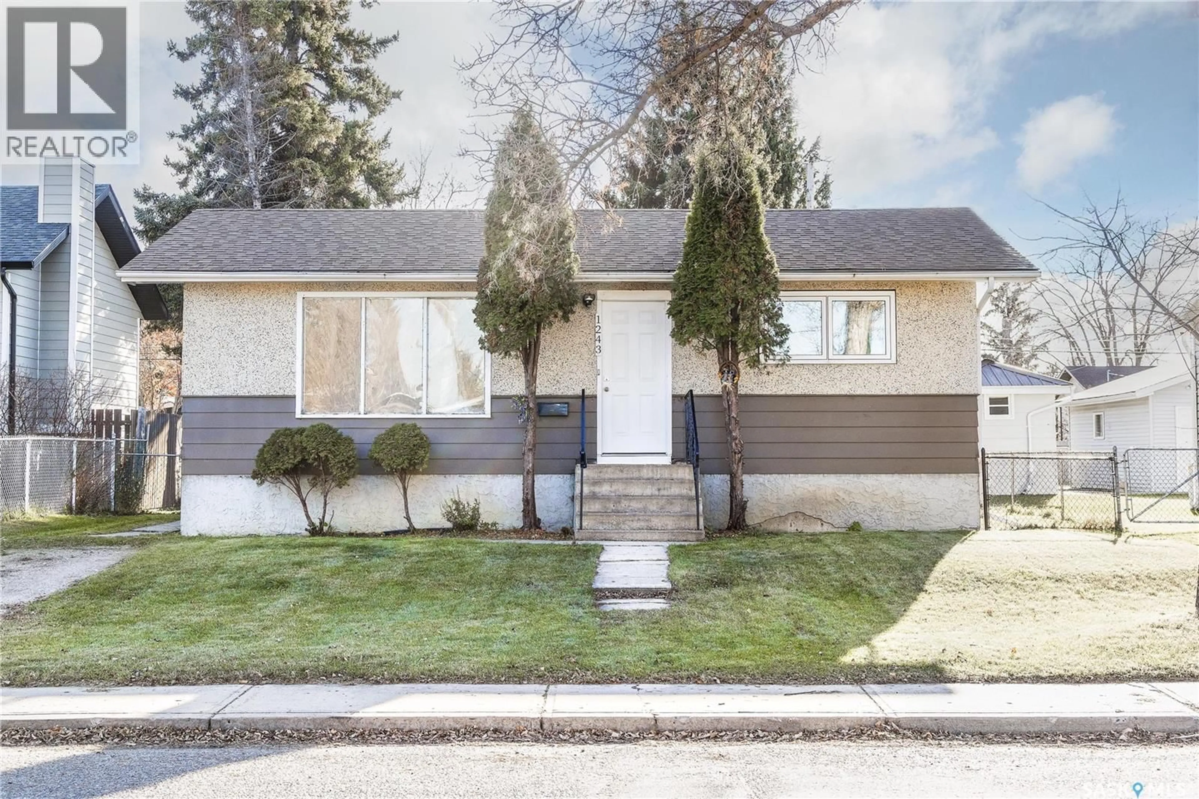 Home with vinyl exterior material, street for 1243 1ST STREET, Prince Albert Saskatchewan S6V0E2