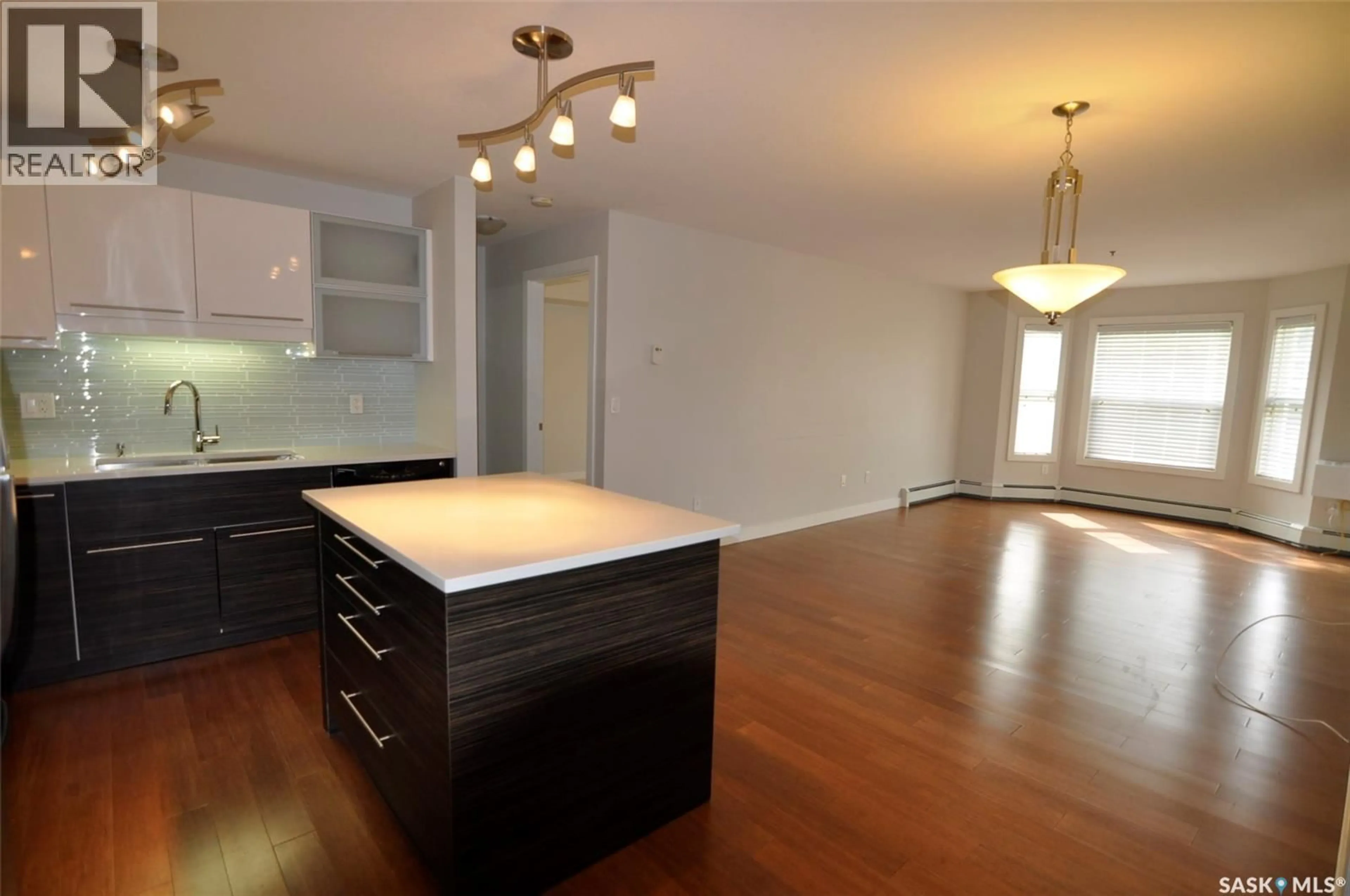 Open concept kitchen, wood/laminate floor for B107 - 415 HUNTER ROAD, Saskatoon Saskatchewan S7T0J7