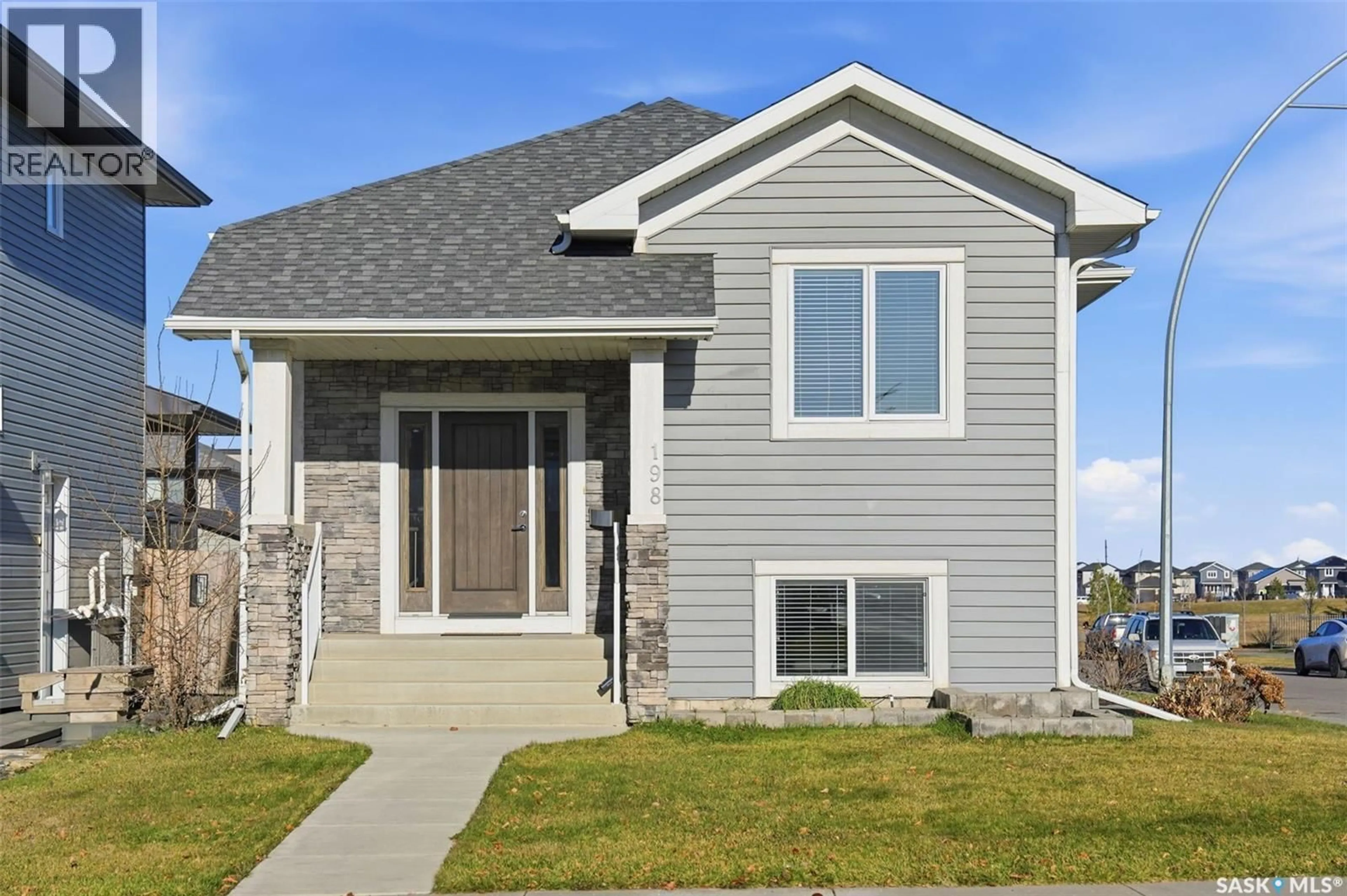 Home with vinyl exterior material, street for 198 RAJPUT WAY, Saskatoon Saskatchewan S7W0L4