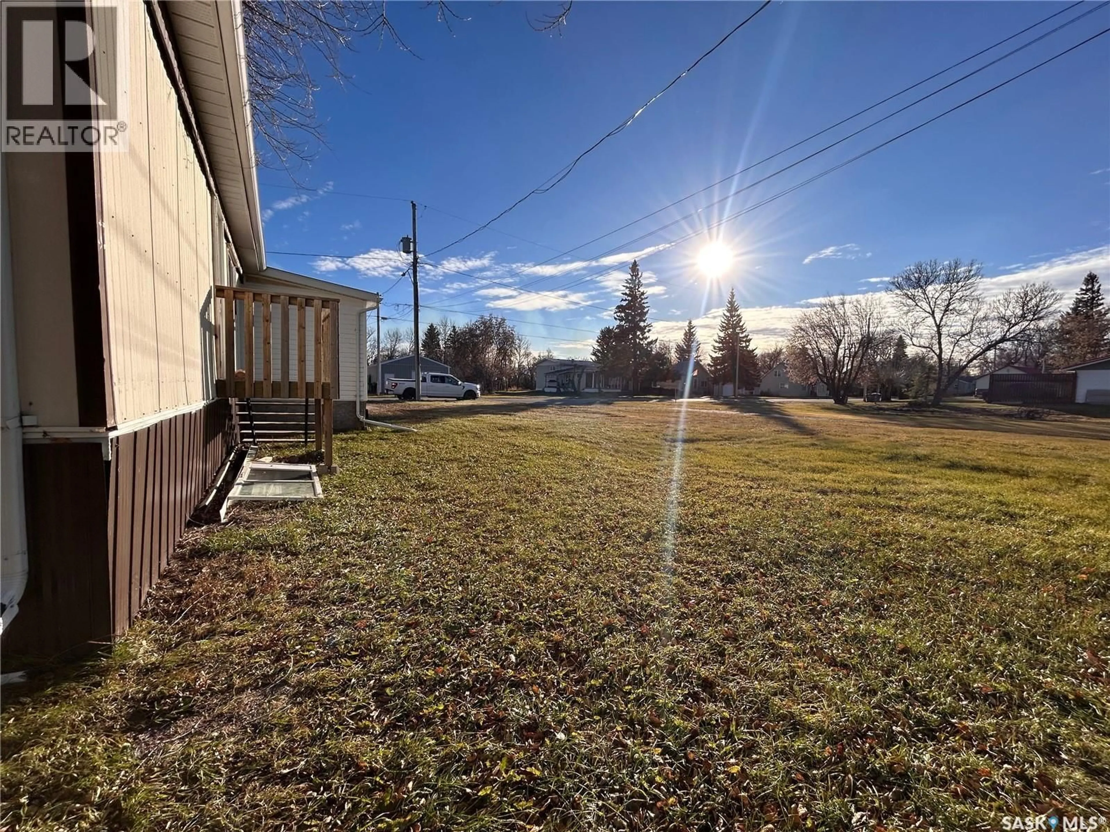 A pic from outside/outdoor area/front of a property/back of a property/a pic from drone, unknown for 211 RAILWAY AVENUE, Wawota Saskatchewan S0G5A0