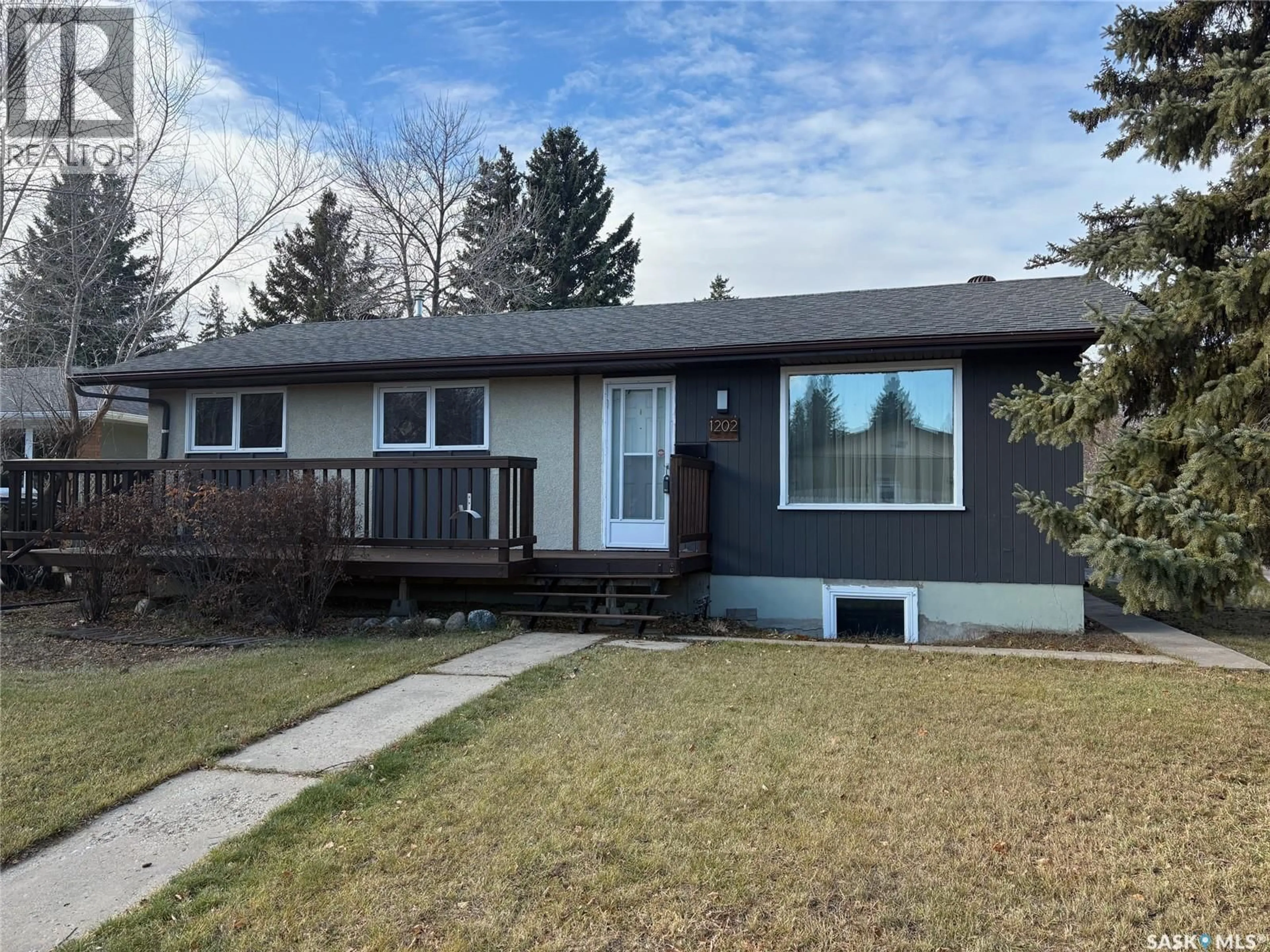 Home with vinyl exterior material, street for 1202 EAST CENTRE, Saskatoon Saskatchewan S7J3A7