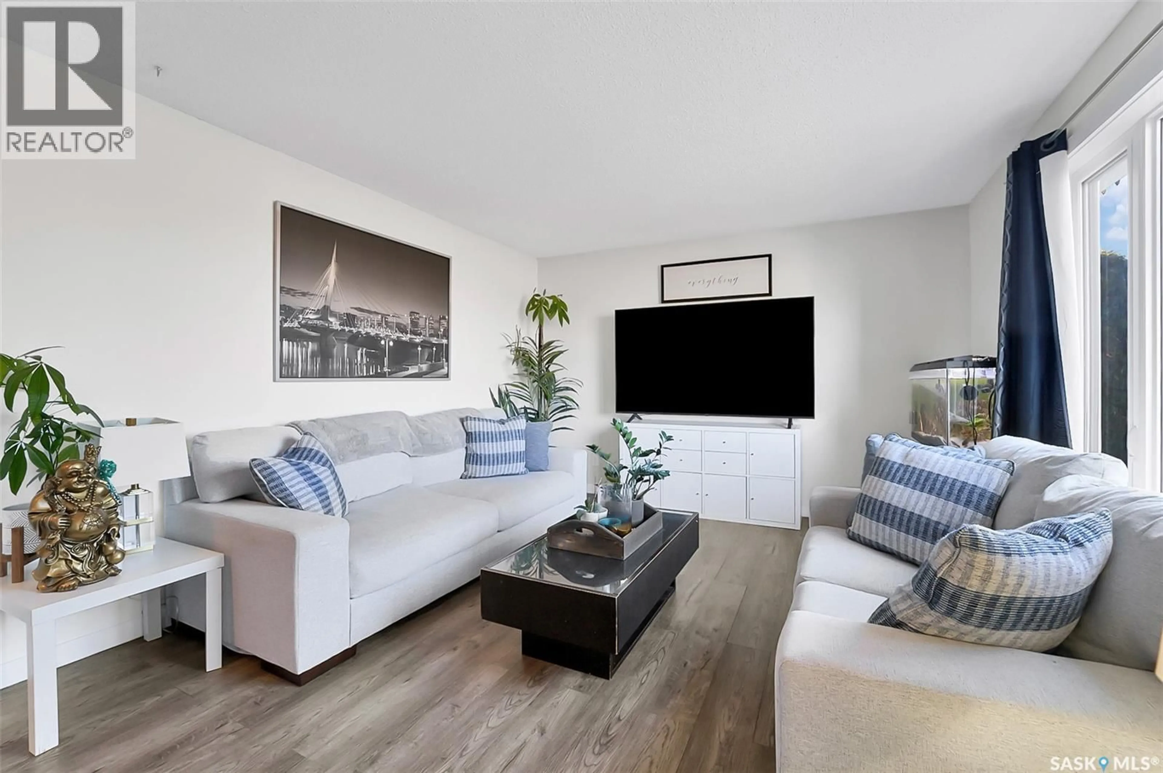 Living room with furniture, wood/laminate floor for 1326 CATHERWOOD AVENUE, Saskatoon Saskatchewan S7L7H1