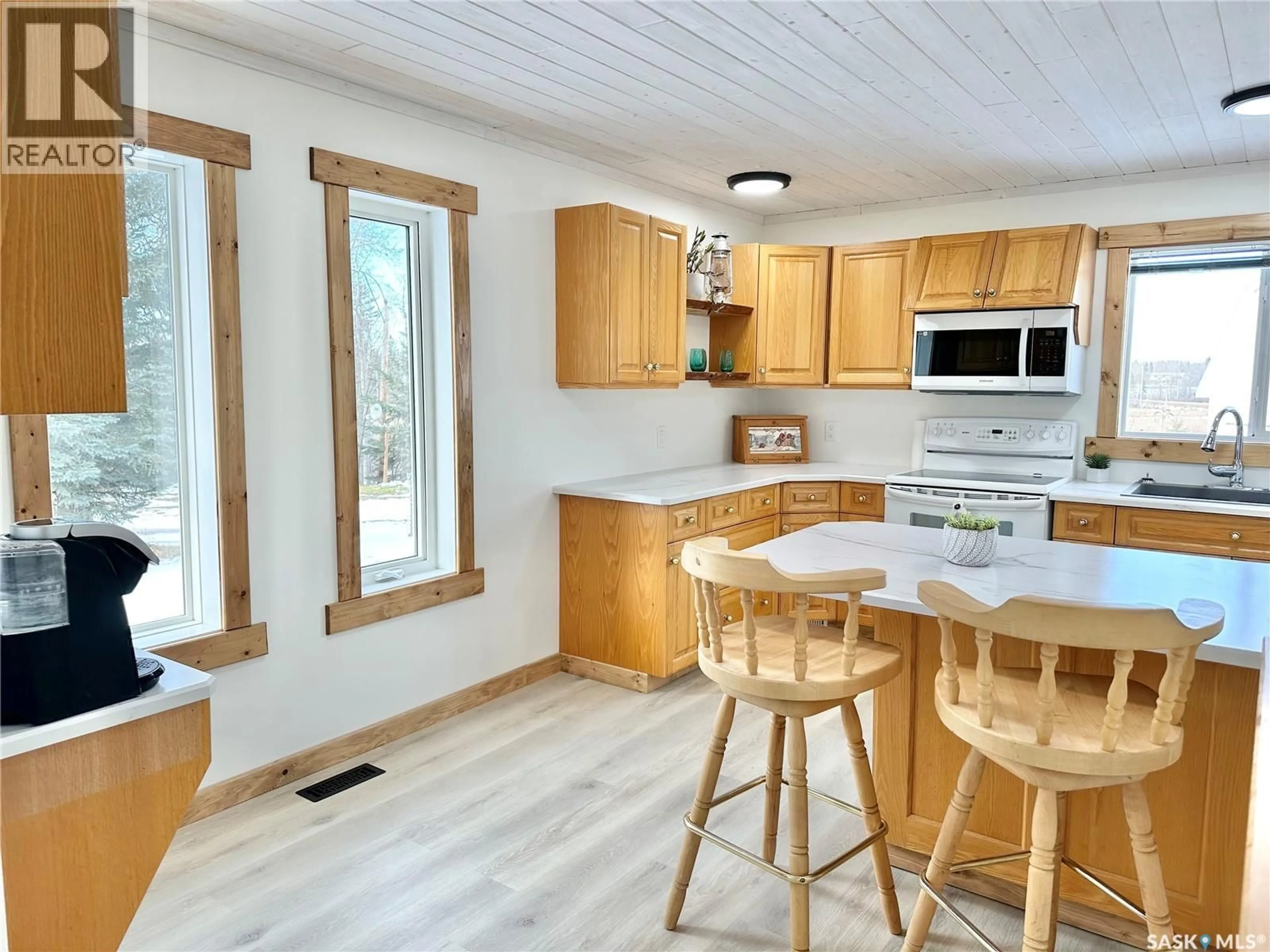 Open concept kitchen, wood/laminate floor for 3 MORROW PLACE, Shell Lake Saskatchewan S0J2G0