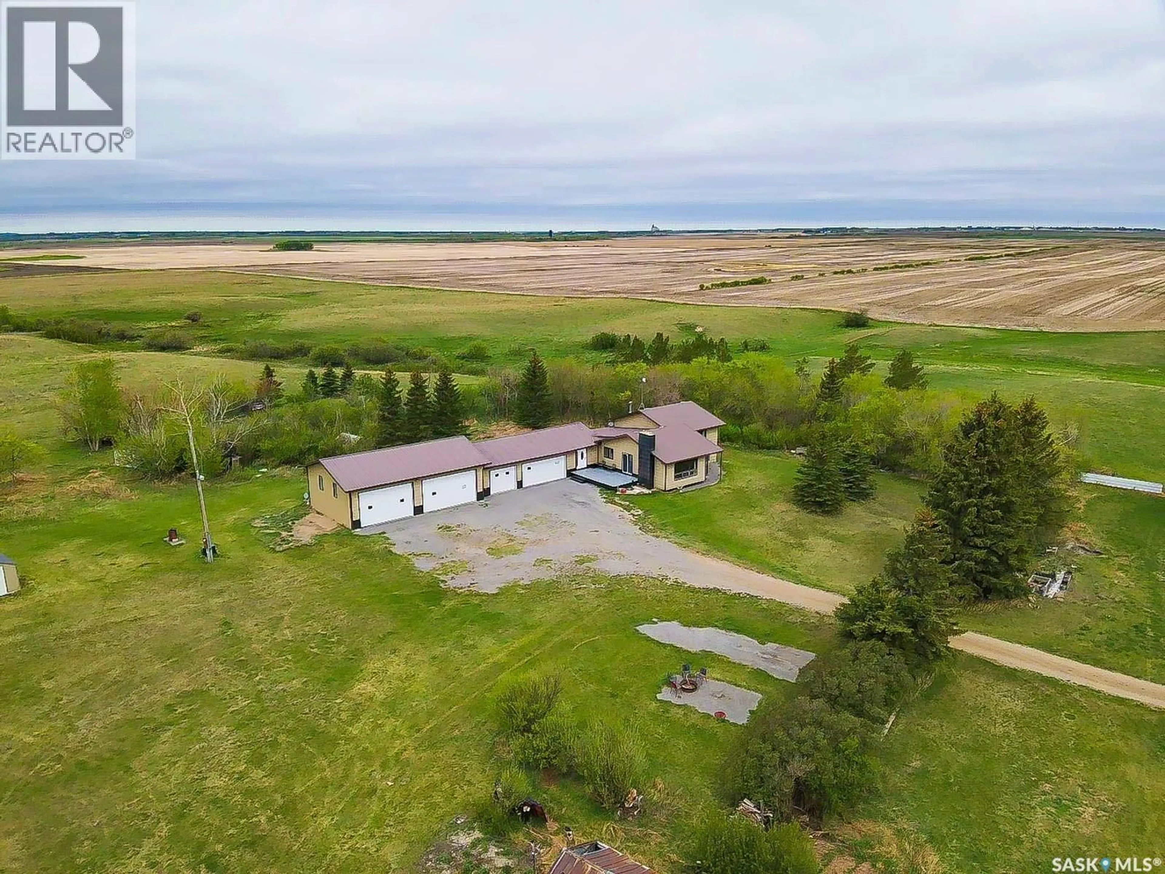 A pic from outside/outdoor area/front of a property/back of a property/a pic from drone, water/lake/river/ocean view for REGINA COMMUTER ACREAGE, Edenwold Rm No.158 Saskatchewan S4L5B1