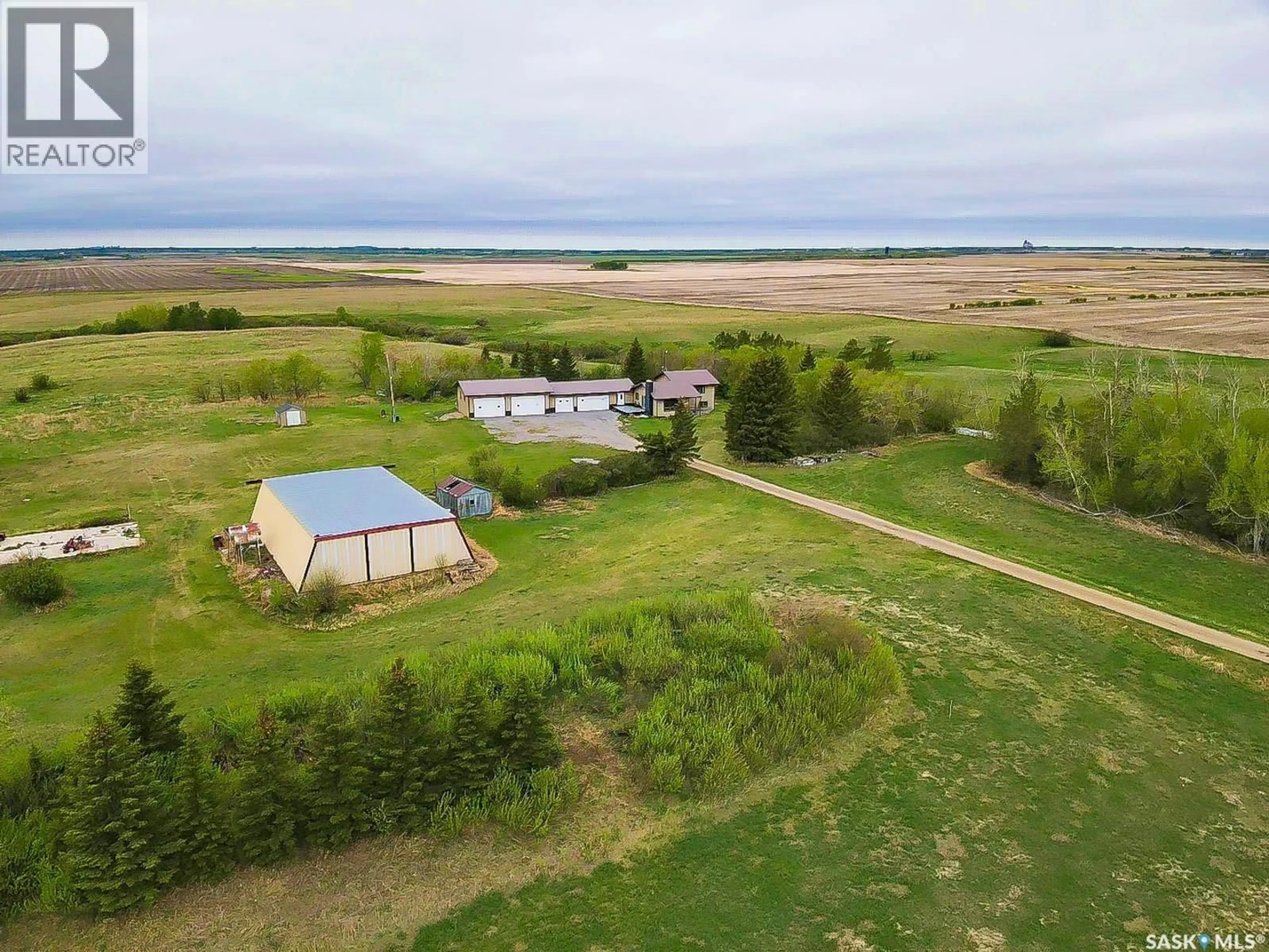 A pic from outside/outdoor area/front of a property/back of a property/a pic from drone, water/lake/river/ocean view for REGINA COMMUTER ACREAGE, Edenwold Rm No.158 Saskatchewan S4L5B1