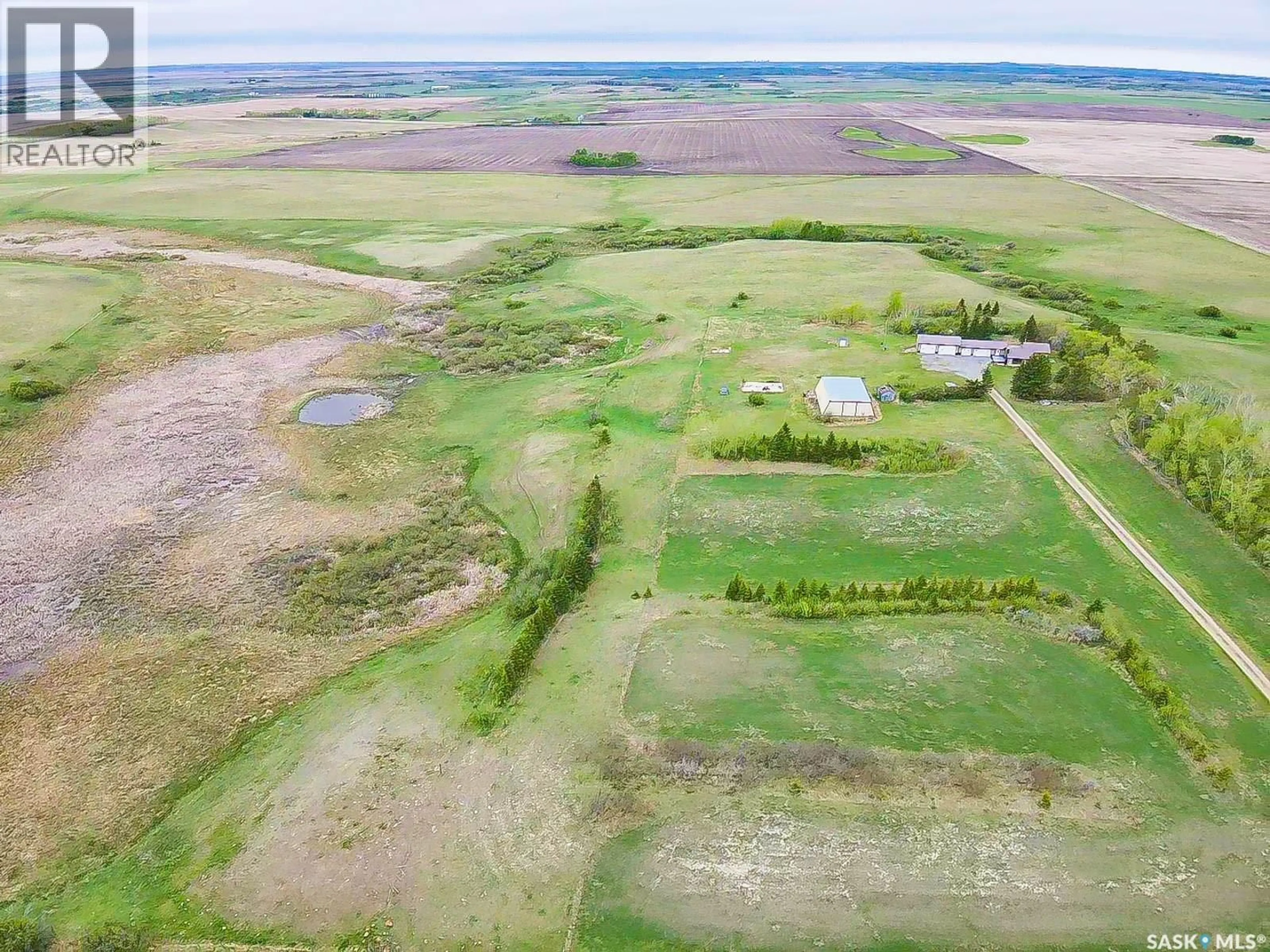 A pic from outside/outdoor area/front of a property/back of a property/a pic from drone, water/lake/river/ocean view for REGINA COMMUTER ACREAGE, Edenwold Rm No.158 Saskatchewan S4L5B1
