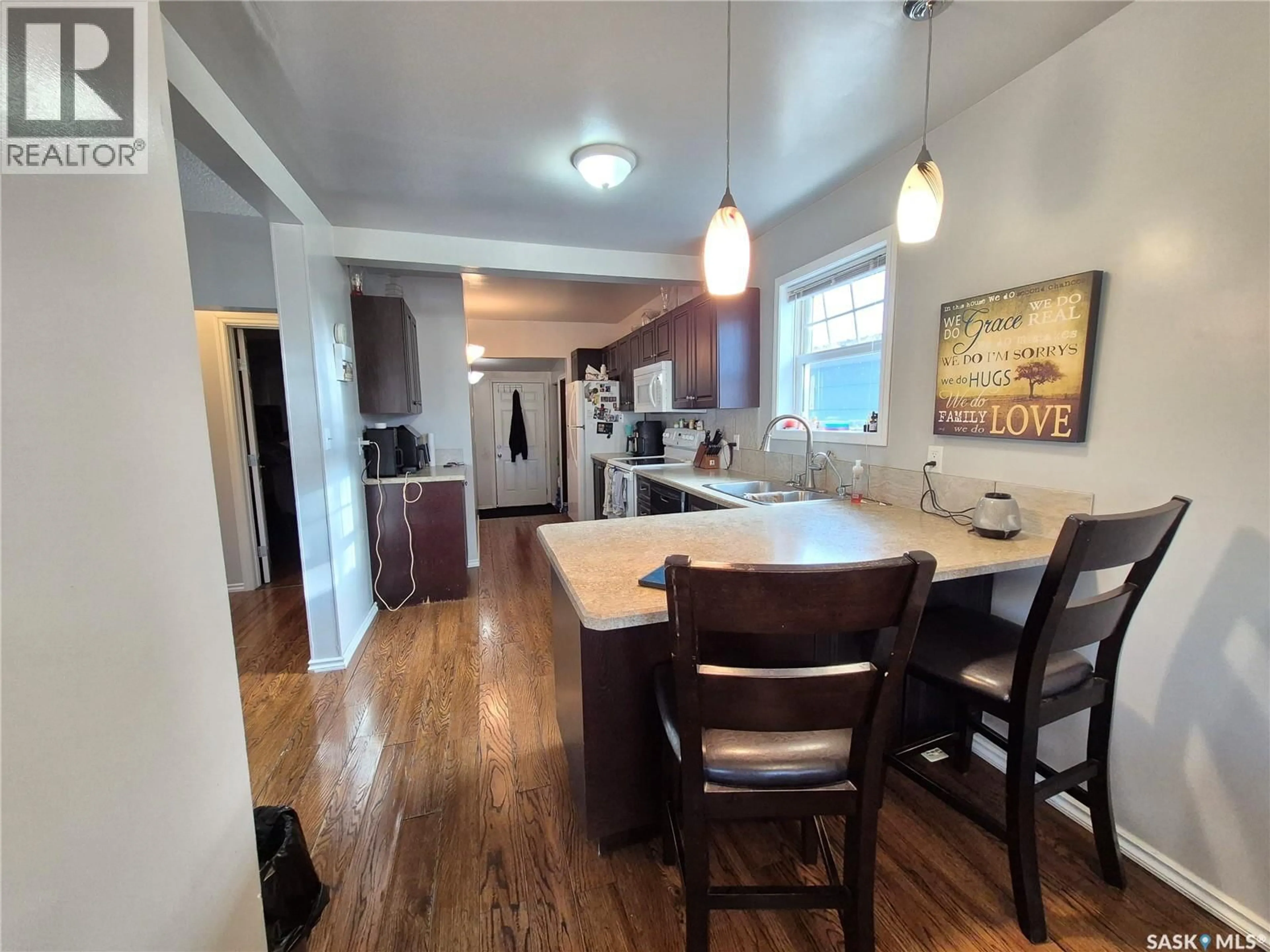 Open concept kitchen, wood/laminate floor for 515 BECKWELL AVENUE, Radville Saskatchewan S0C2G0