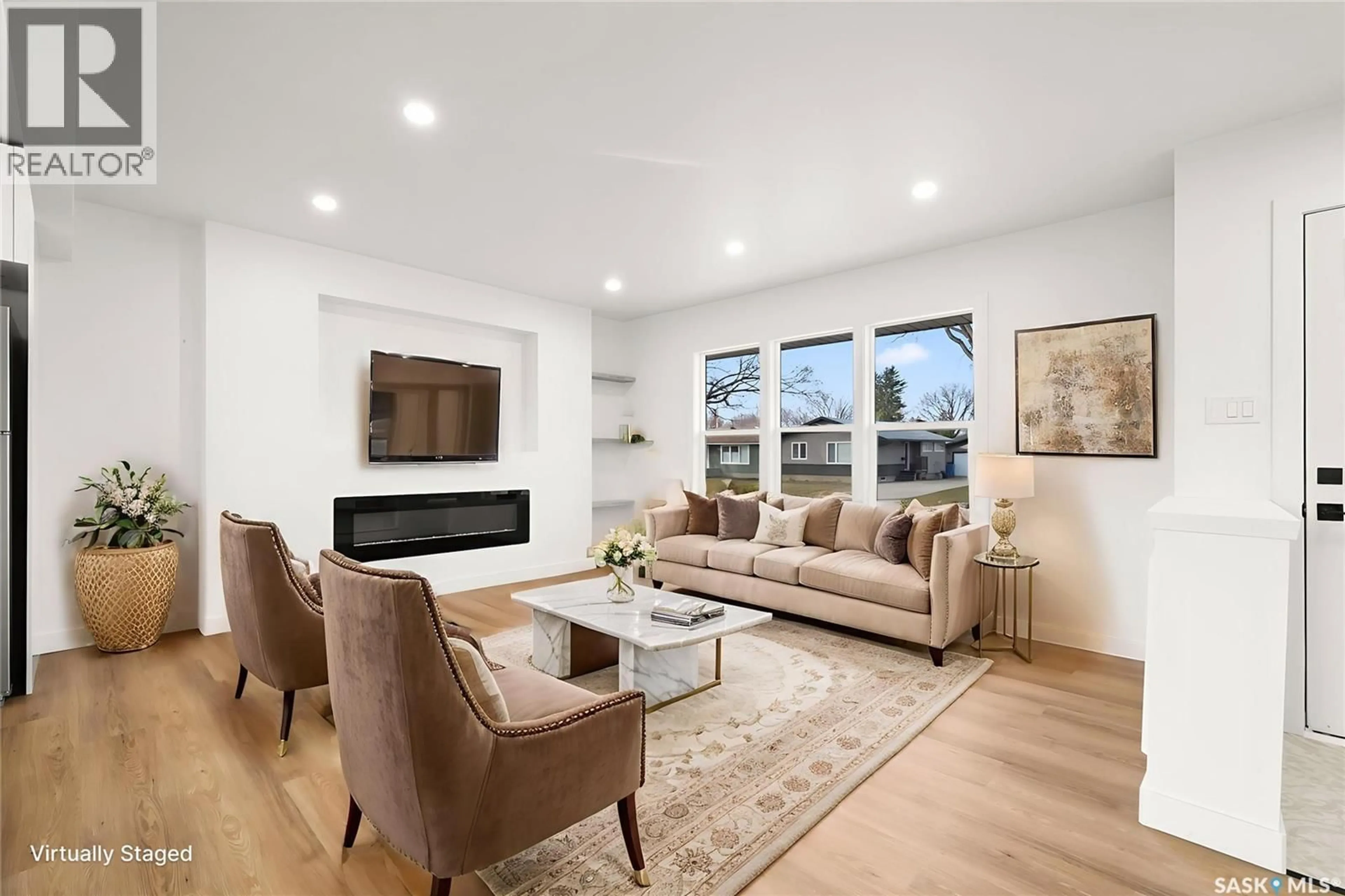 Living room with furniture, wood/laminate floor for 35 LAIRD CRESCENT, Regina Saskatchewan S4R4N7