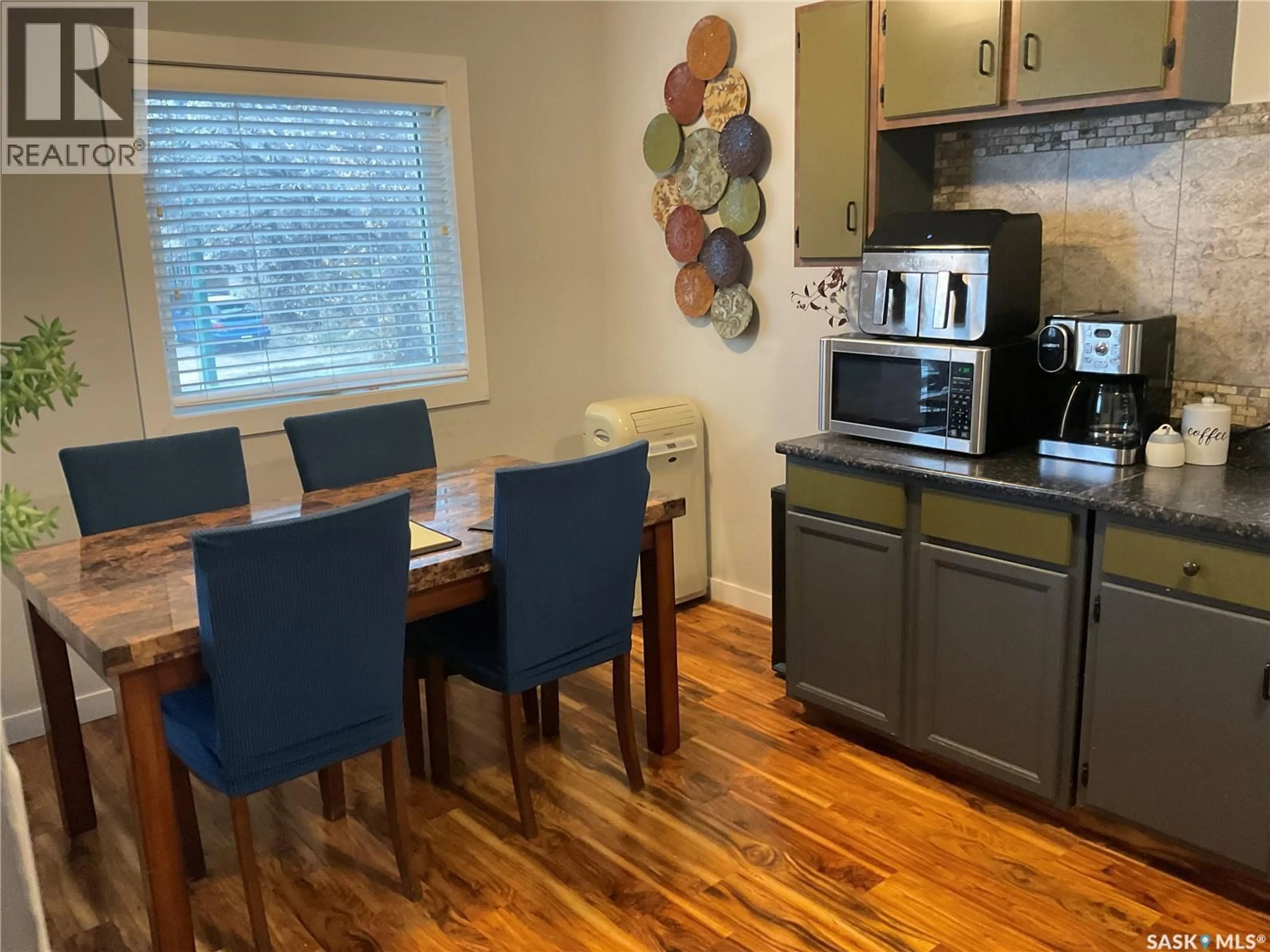 Open concept kitchen, wood/laminate floor for 1613 - 1611 LAURA AVENUE, Saskatoon Saskatchewan S7N2T2