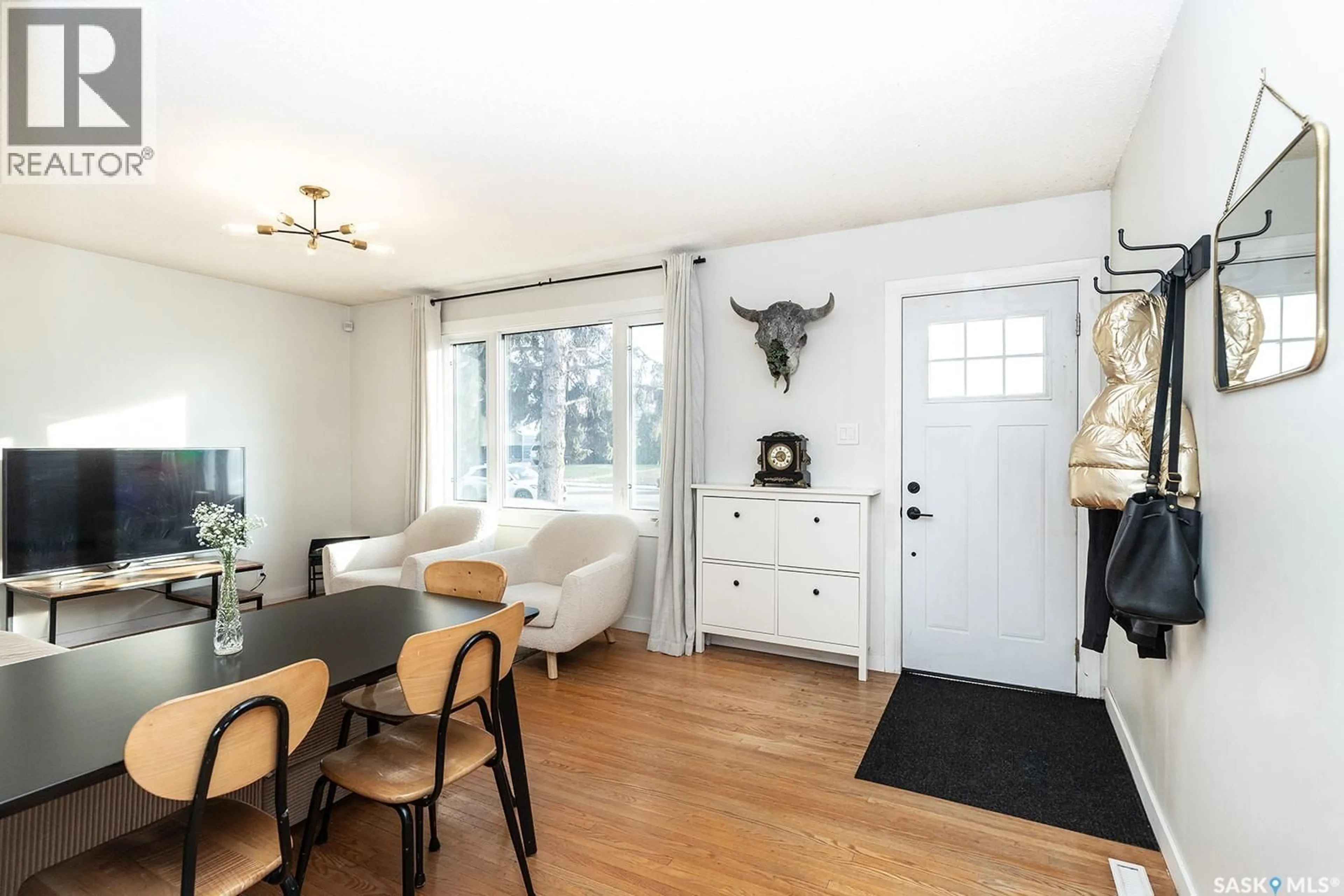 Living room with furniture, wood/laminate floor for 2212 YORK AVENUE, Saskatoon Saskatchewan S7J1J1