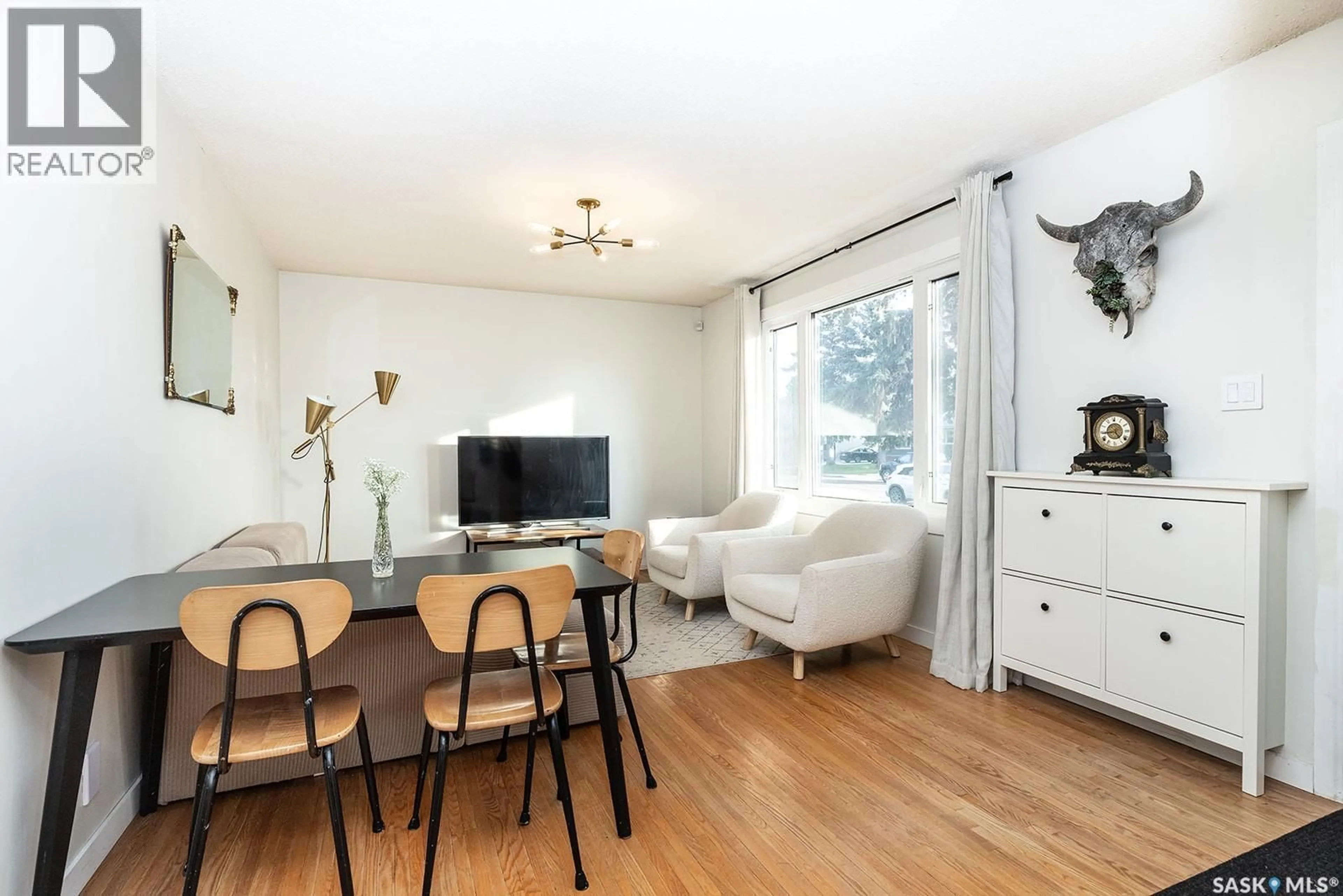 Living room with furniture, wood/laminate floor for 2212 YORK AVENUE, Saskatoon Saskatchewan S7J1J1