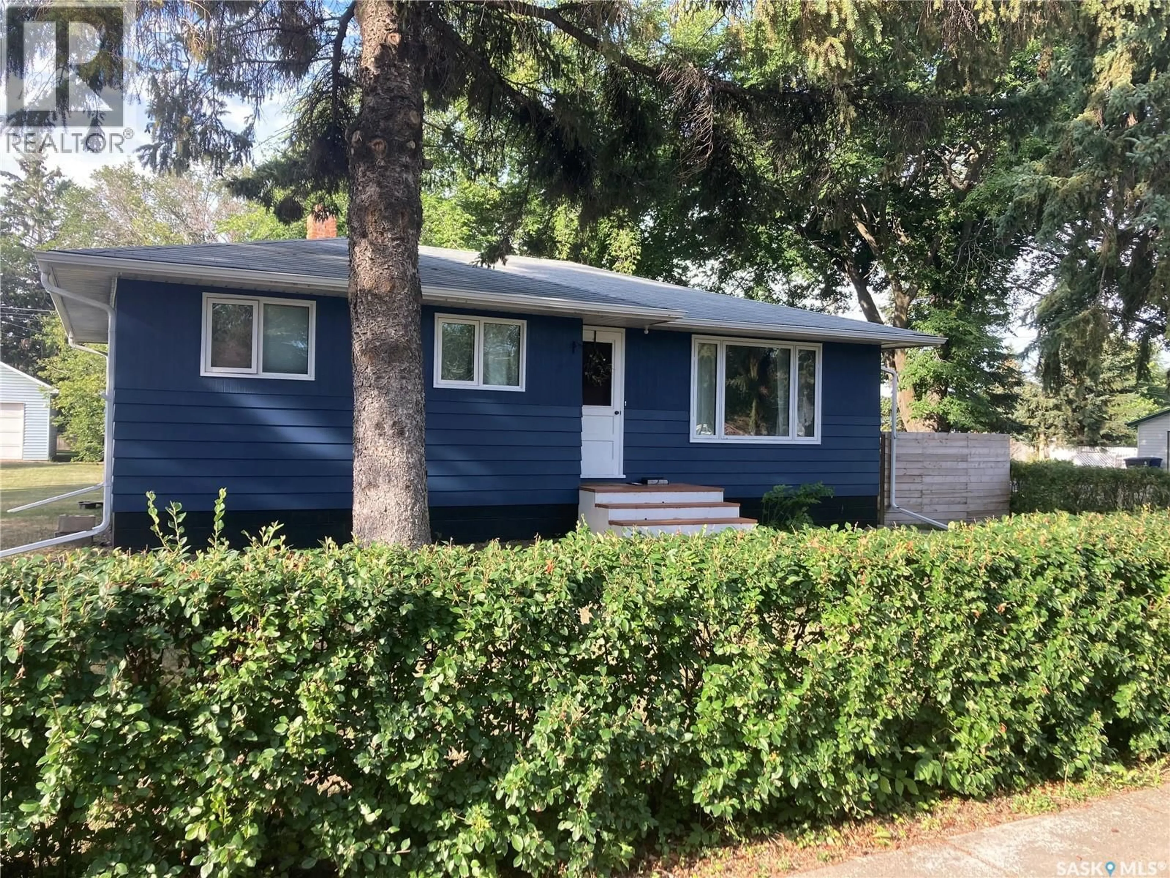 Home with vinyl exterior material, street for 1019 8TH STREET, Rosthern Saskatchewan S0K3R0