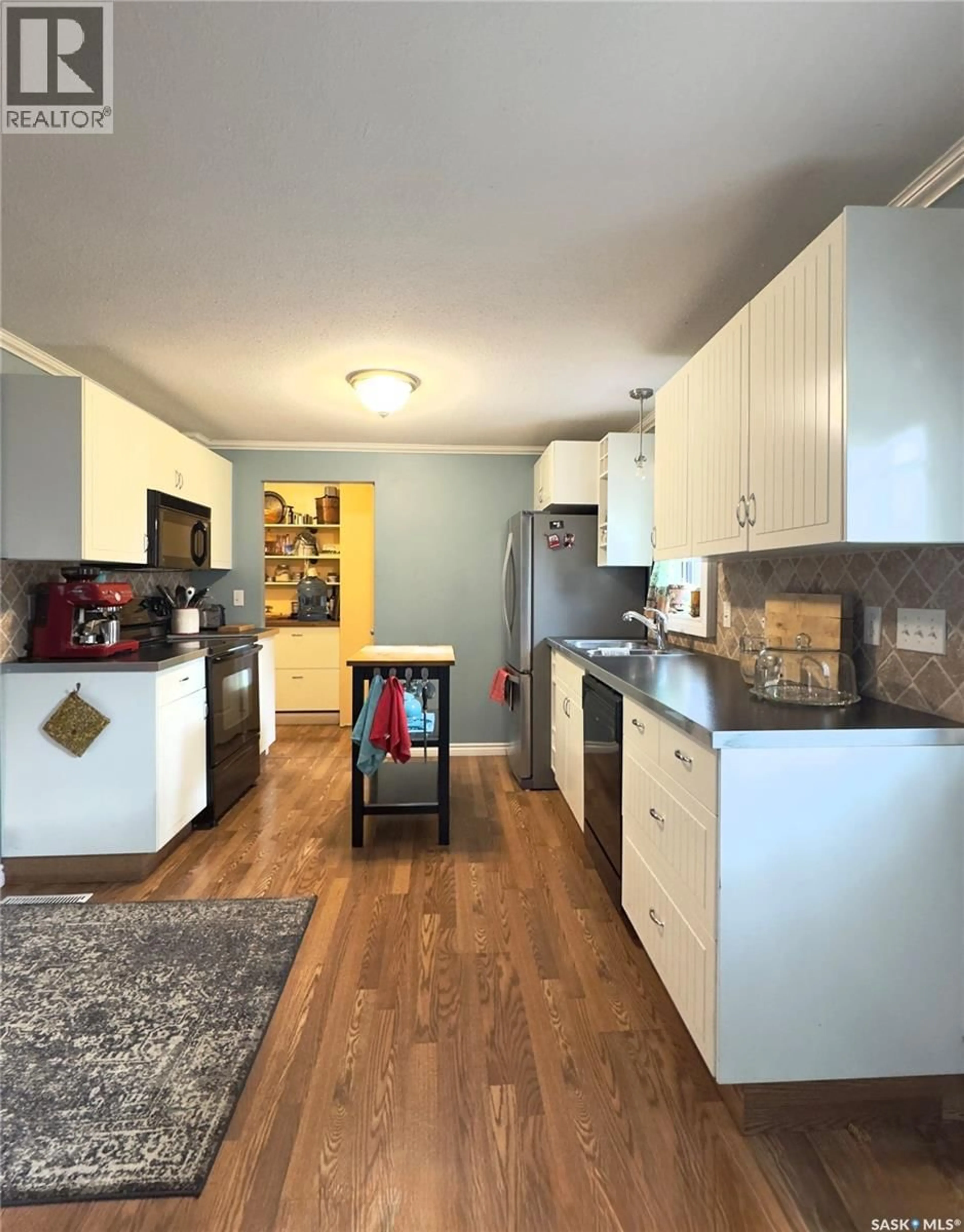 Open concept kitchen, wood/laminate floor for 109 1ST STREET, Waldheim Saskatchewan S0K4R0