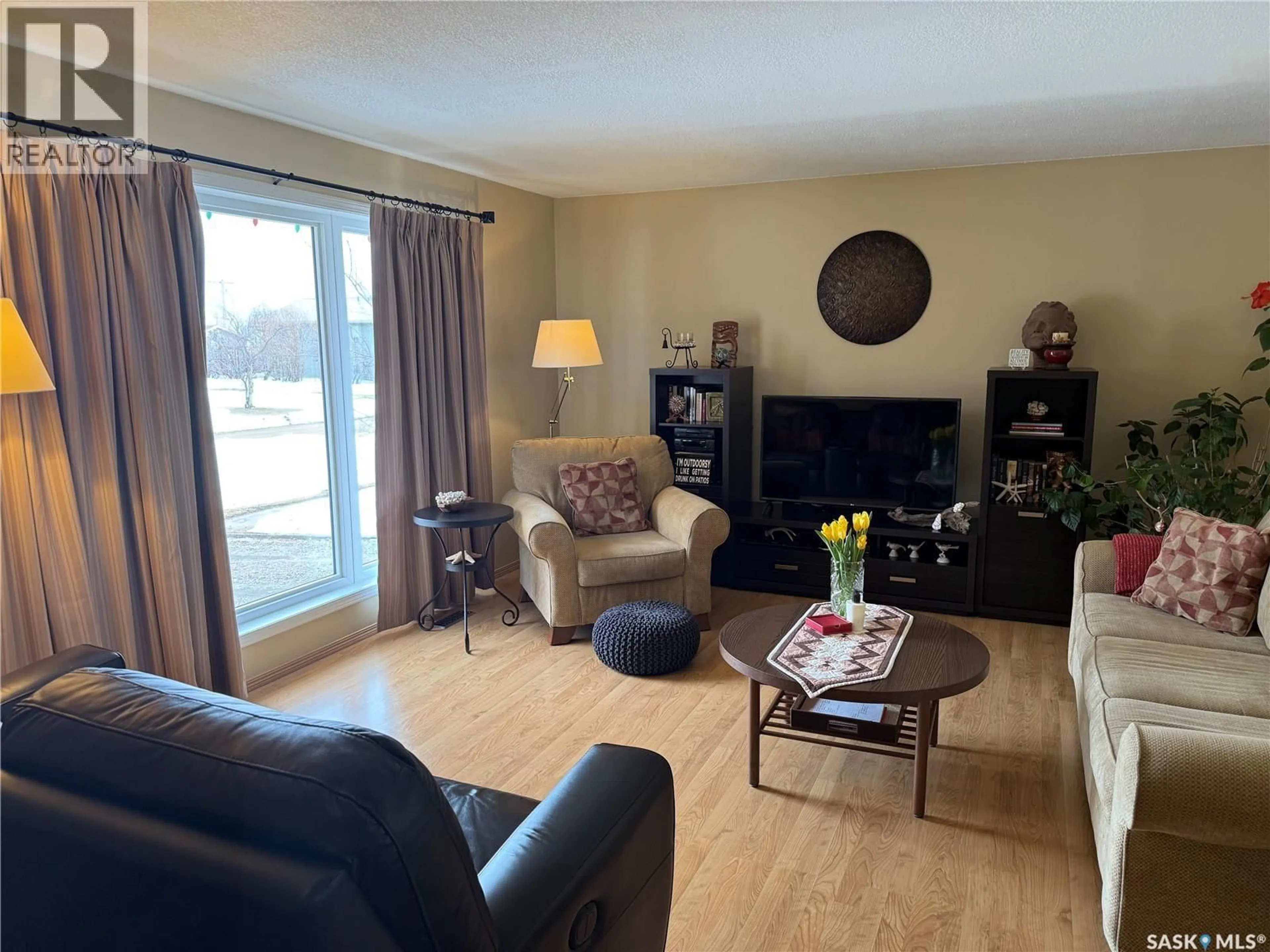 Living room with furniture, wood/laminate floor for 421 LOGAN AVENUE, White Fox Saskatchewan S0J3B0