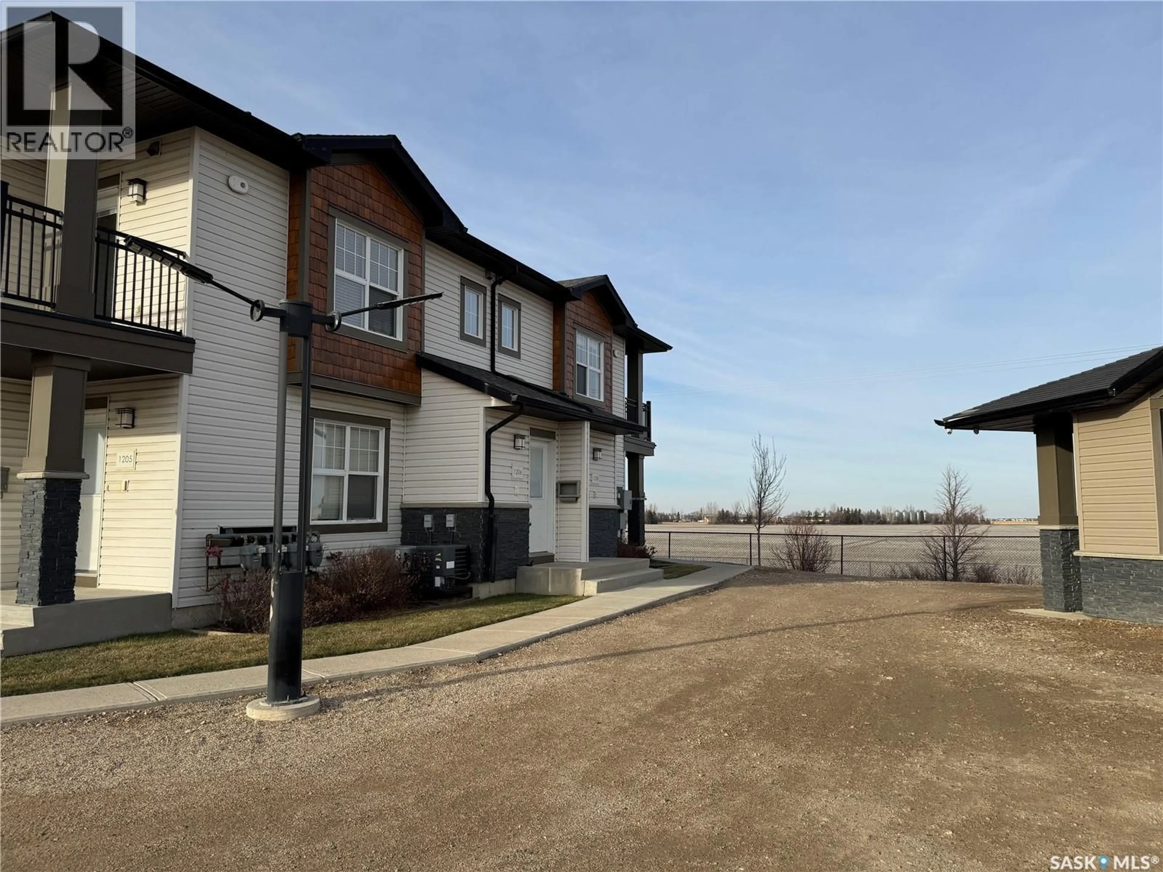 A pic from outside/outdoor area/front of a property/back of a property/a pic from drone, street for 1015 - 1206 PATRICK CRESCENT, Saskatoon Saskatchewan S7W0M5