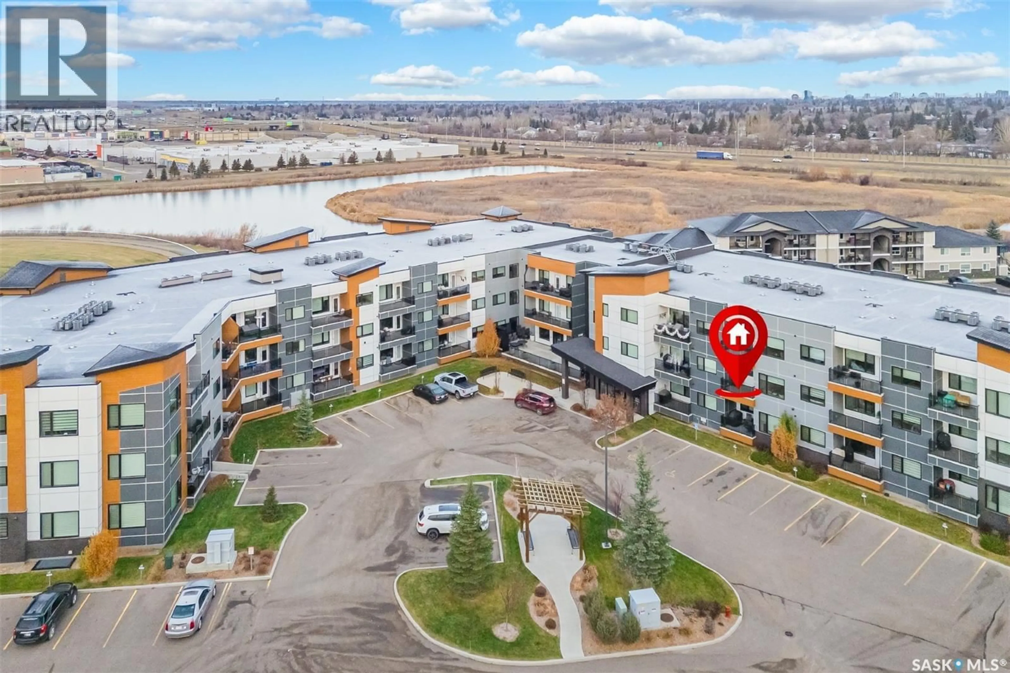 A pic from outside/outdoor area/front of a property/back of a property/a pic from drone, unknown for 212 105 WILLIS CRESCENT, Saskatoon Saskatchewan S7T0Z3