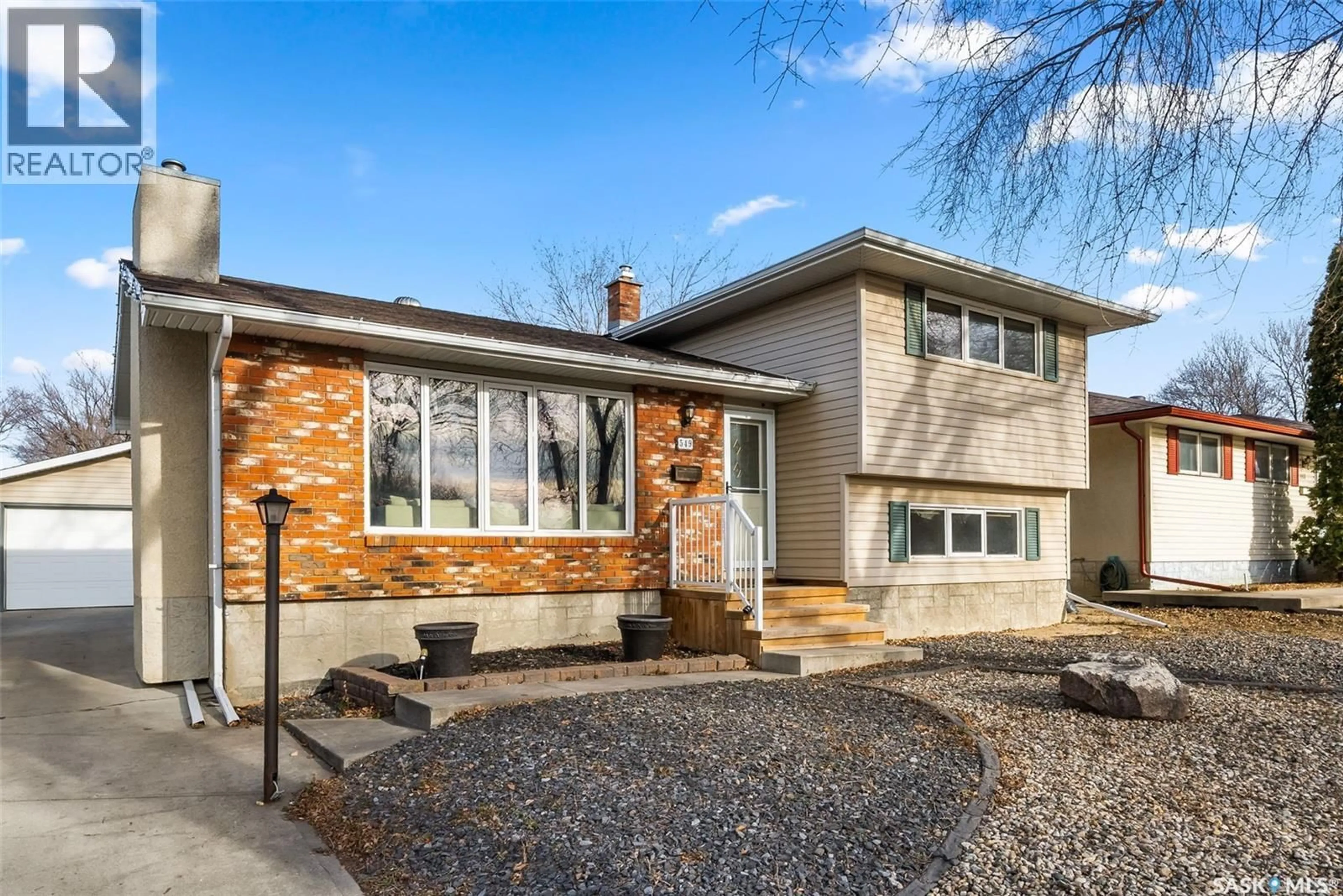 Home with brick exterior material, street for 549 DALGLIESH DRIVE, Regina Saskatchewan S4R6H6