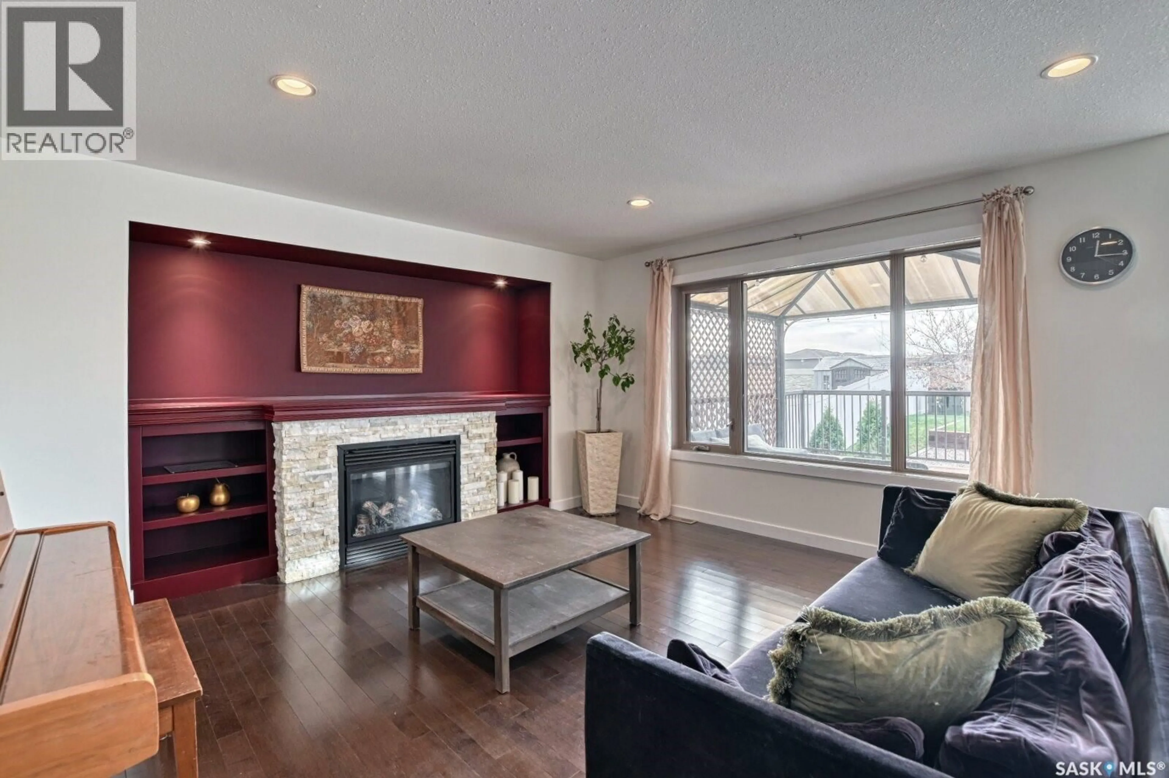 Living room with furniture, wood/laminate floor for 3765 GREEN MOSS LANE, Regina Saskatchewan S4V1P7