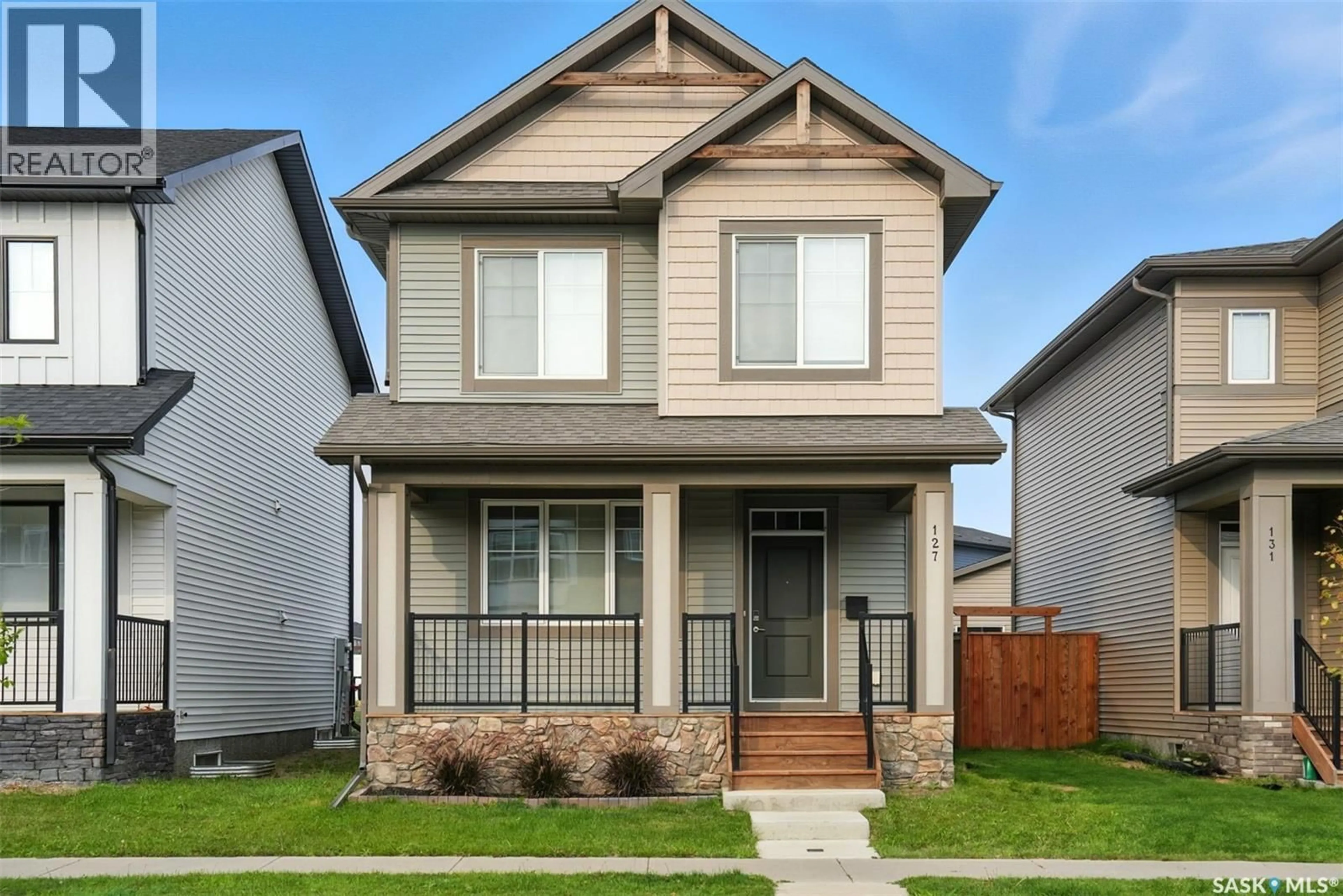 Home with vinyl exterior material, street for 127 TAUBE AVENUE, Saskatoon Saskatchewan S7V0W1