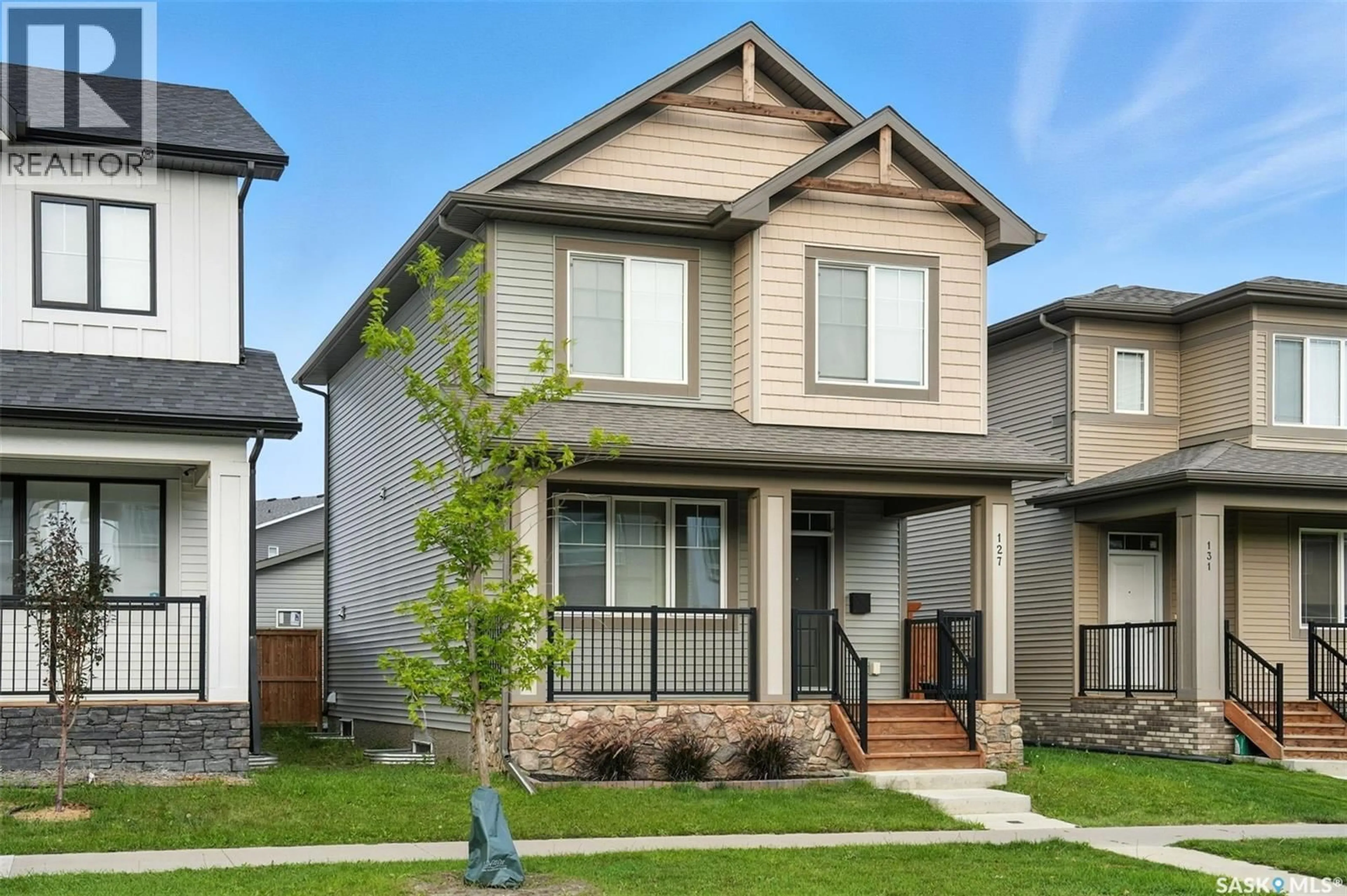 Home with vinyl exterior material, street for 127 TAUBE AVENUE, Saskatoon Saskatchewan S7V0W1