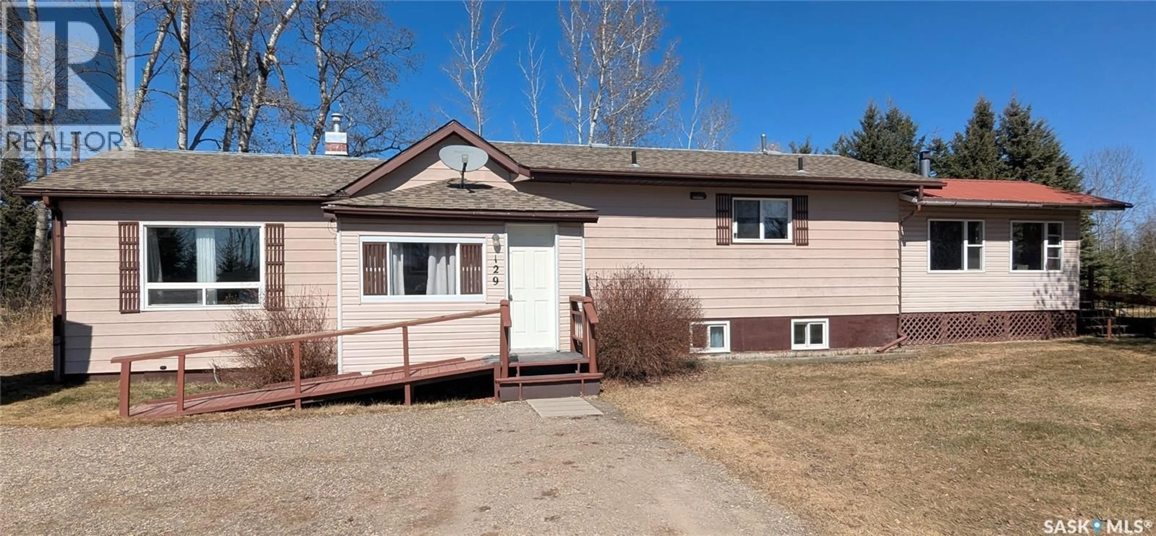 Home with vinyl exterior material, street for 129 LEMIEUX CRESCENT, Leoville Saskatchewan S0J1N0