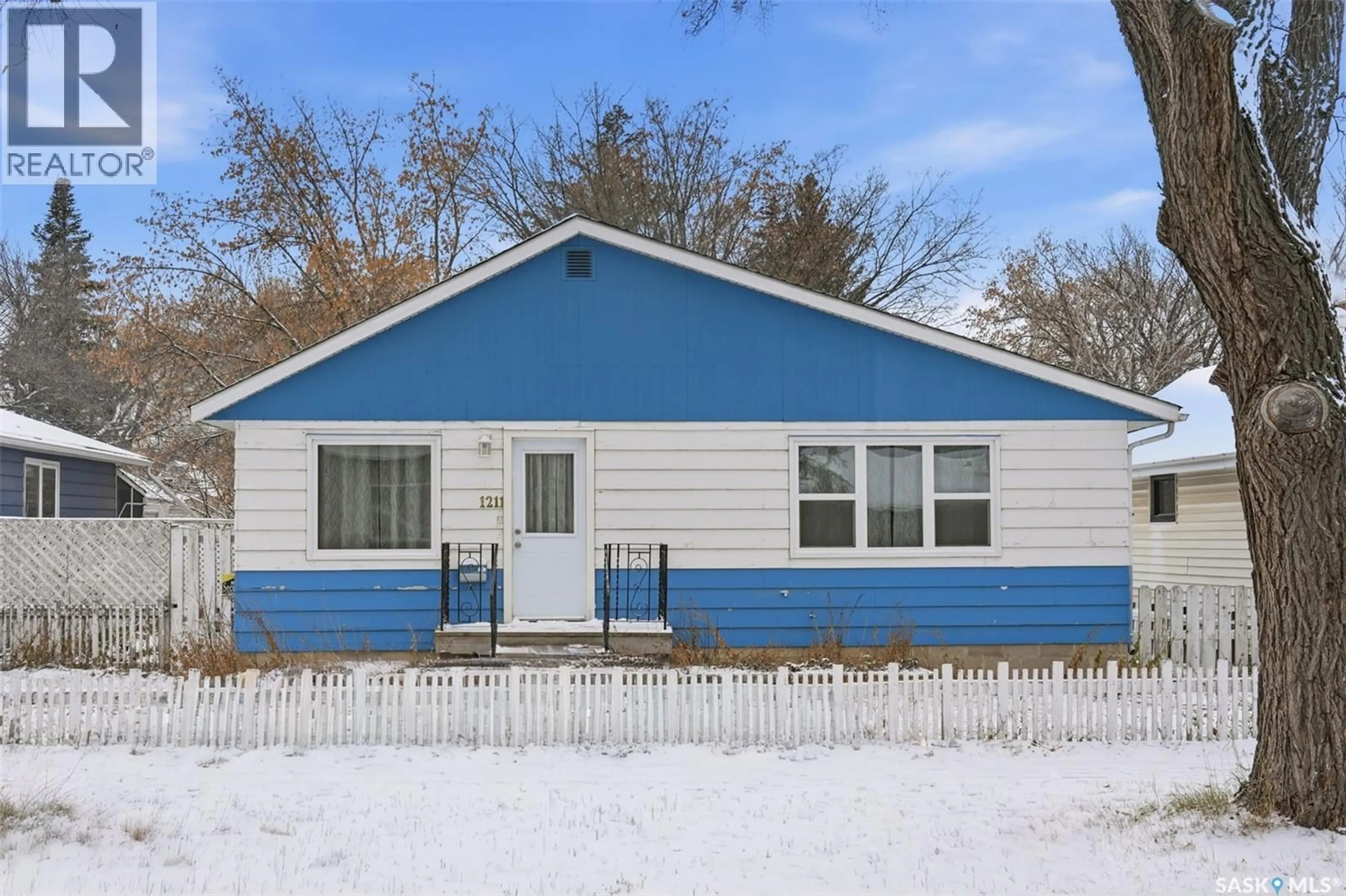 Home with vinyl exterior material, street for 1211 D AVENUE, Saskatoon Saskatchewan S7L1N9
