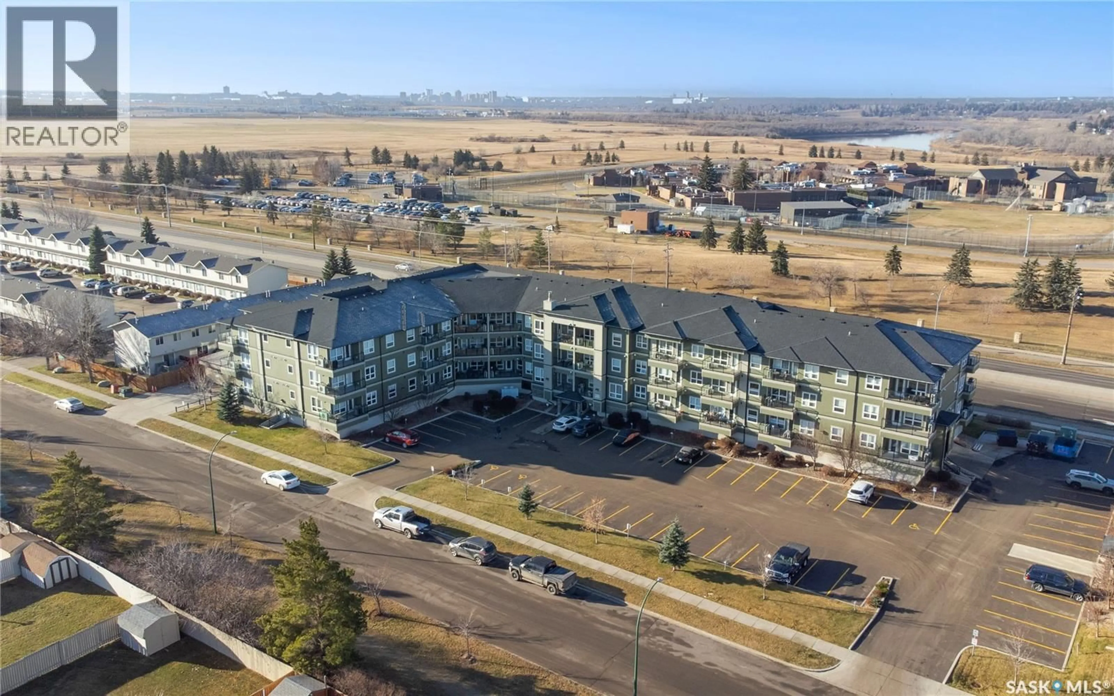 A pic from outside/outdoor area/front of a property/back of a property/a pic from drone, unknown for 915 - 310 KRISTJANSON ROAD, Saskatoon Saskatchewan S7S0B1