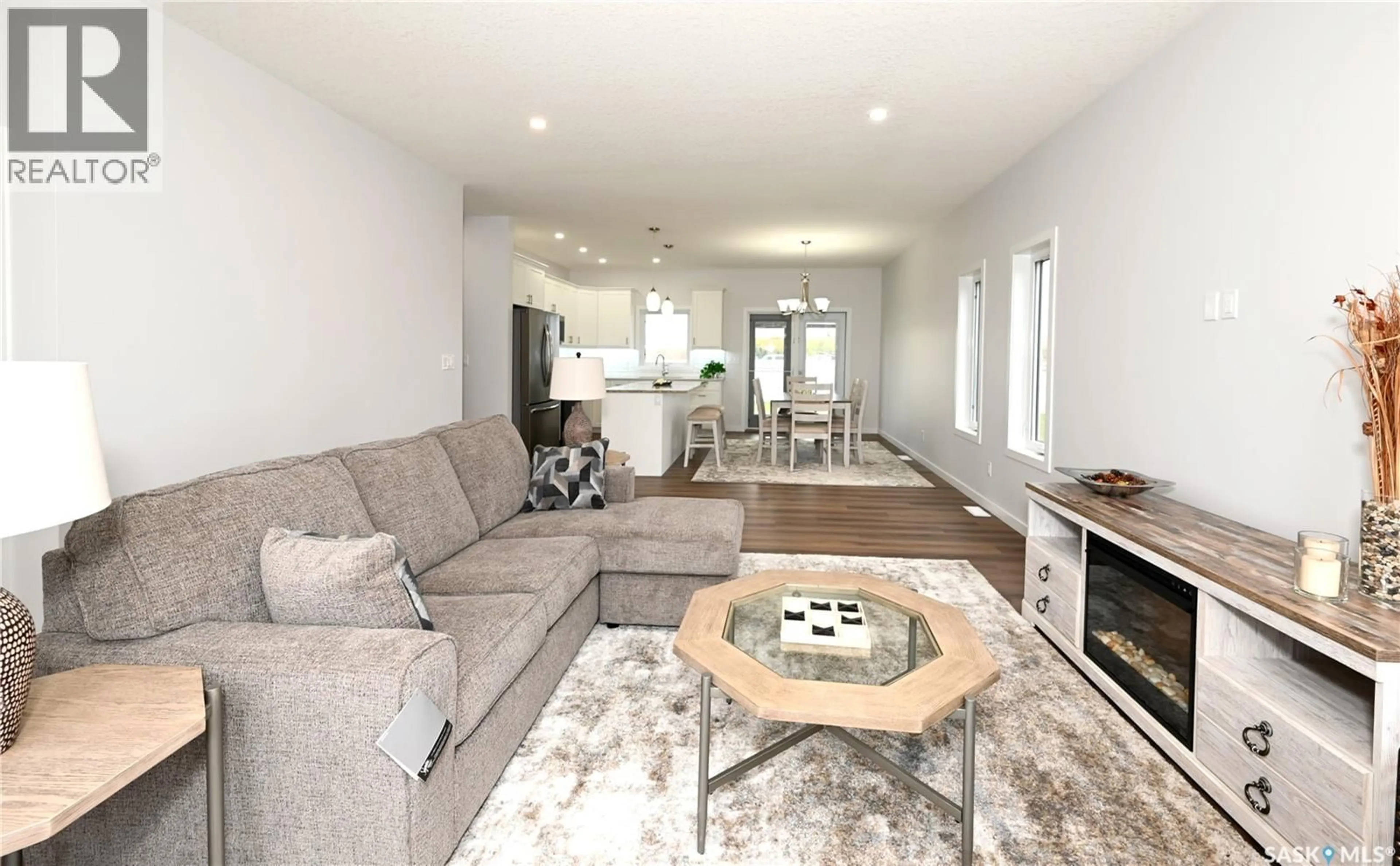 Living room with furniture, wood/laminate floor for 3 - 2330 MORSKY DRIVE, Estevan Saskatchewan S4A3A5