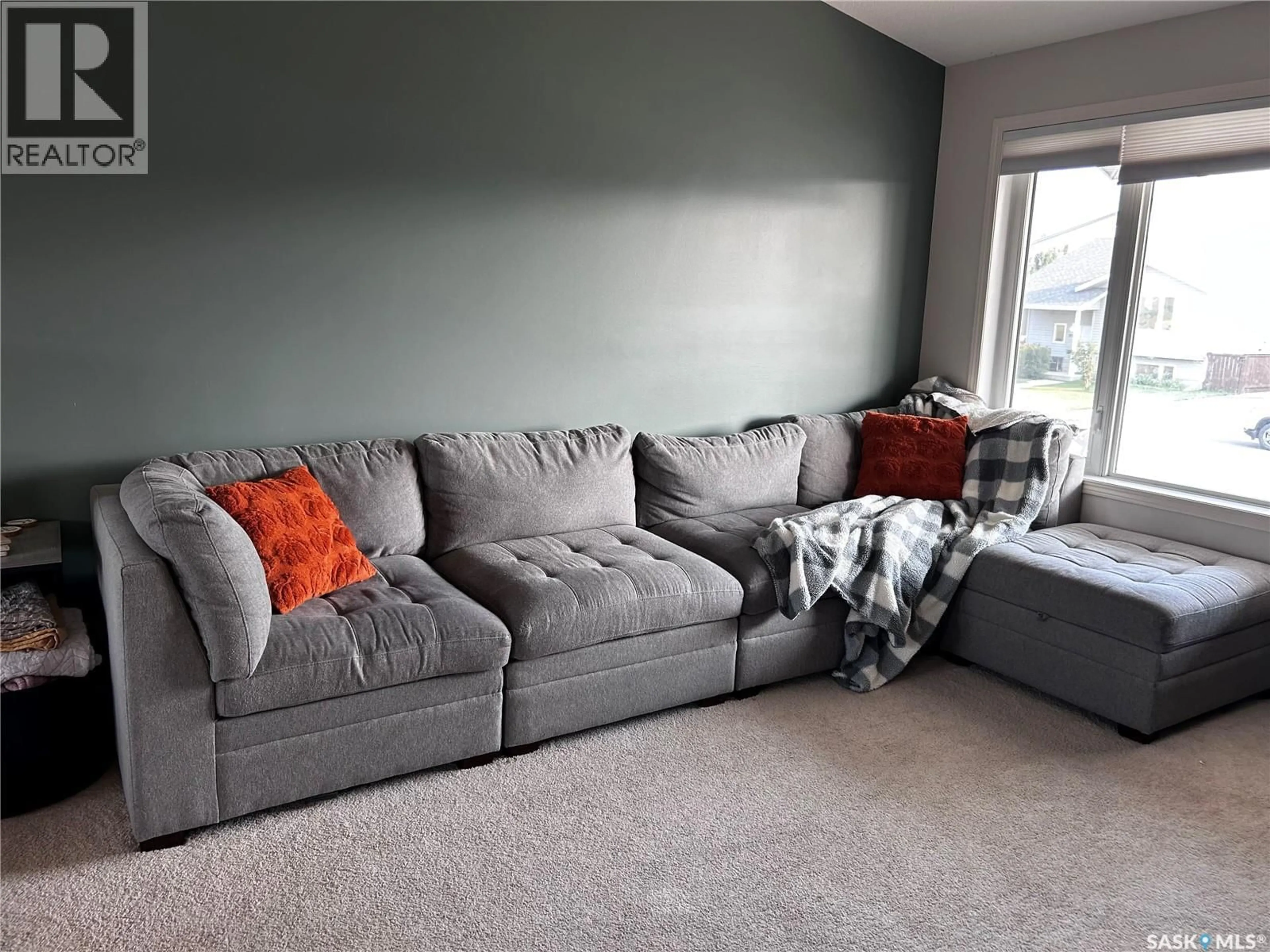 Living room with furniture, carpet floor for 813 LOCHWOOD PLACE, Swift Current Saskatchewan S9H4W9