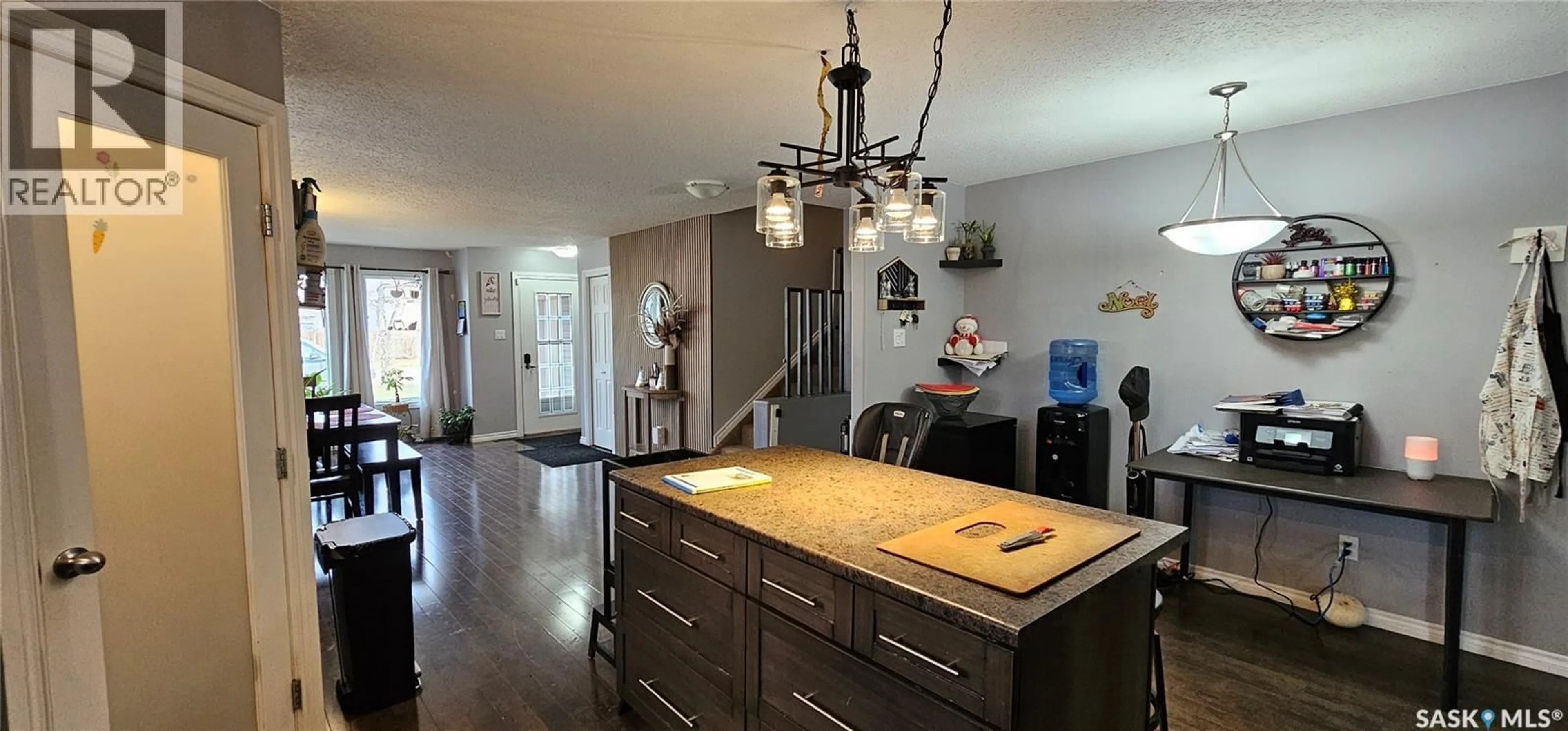 Open concept kitchen, wood/laminate floor for 914 108TH AVENUE, Tisdale Saskatchewan S0E1T0